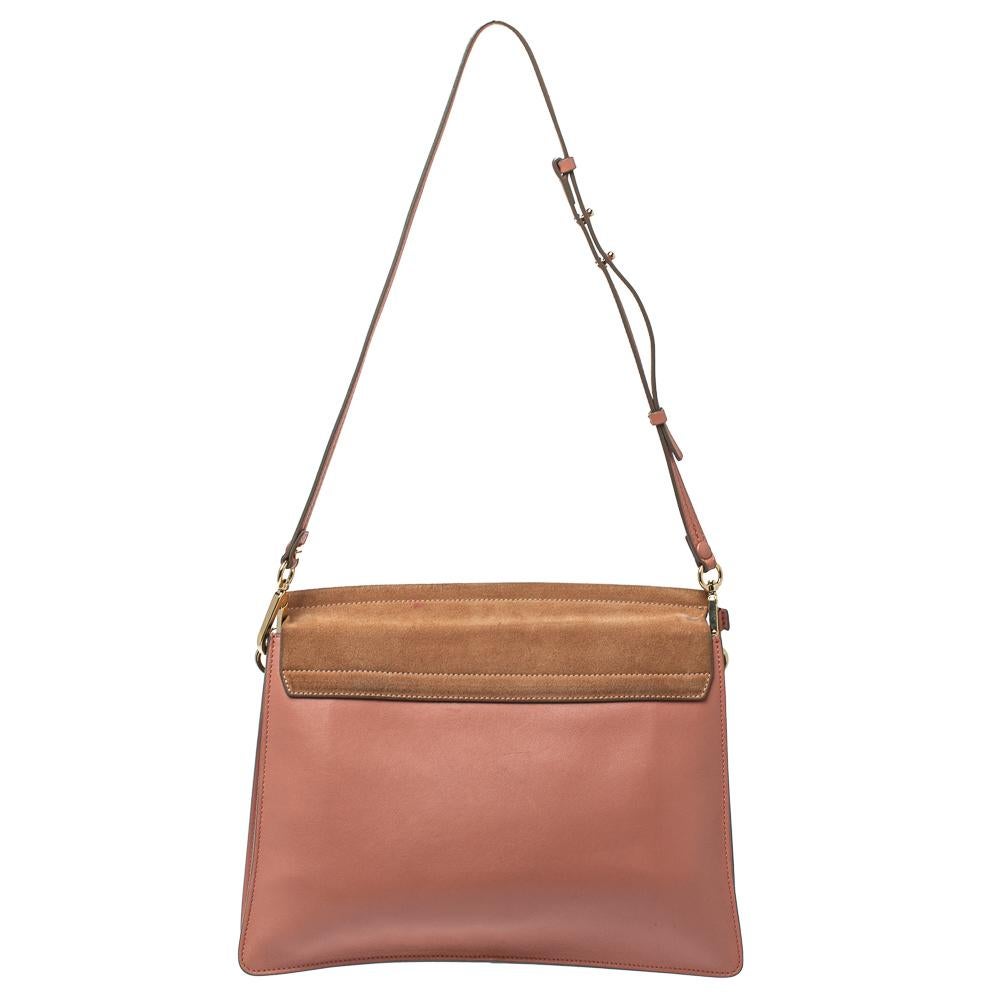 You are going to love owning this Faye shoulder bag from Chloe as it is well-made and brimming with luxury. The bag has been crafted from leather as well as suede and designed with a flap with a chain detail and well-sized suede compartments for