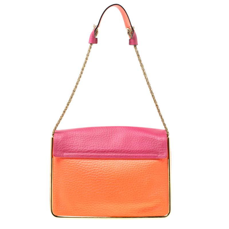 Gorgeous is the word for this Sally bag from Chloe! The pink and coral orange bag has been crafted from leather and styled with a front flap that features a gold-tone flip lock. It flaunts a chain and leather shoulder strap and comes equipped with