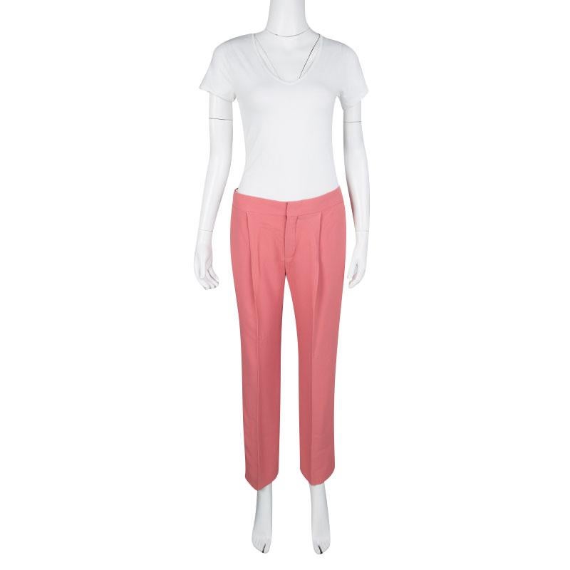 Tailored to exude a look of pure sophistication, this pair of trousers by Chloe are perfect for a nine-to-nine transition. Characterized by a pleated front that gives it a snug fit, these tapered trousers can be paired with your shirts and blouses