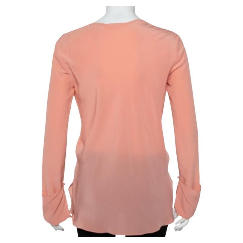 You must add this simple yet sophisticated blouse by Chloe to your understated closet now! Crafted with silk, it features a draped neckline, well suited long sleeves and a flattering fit.
