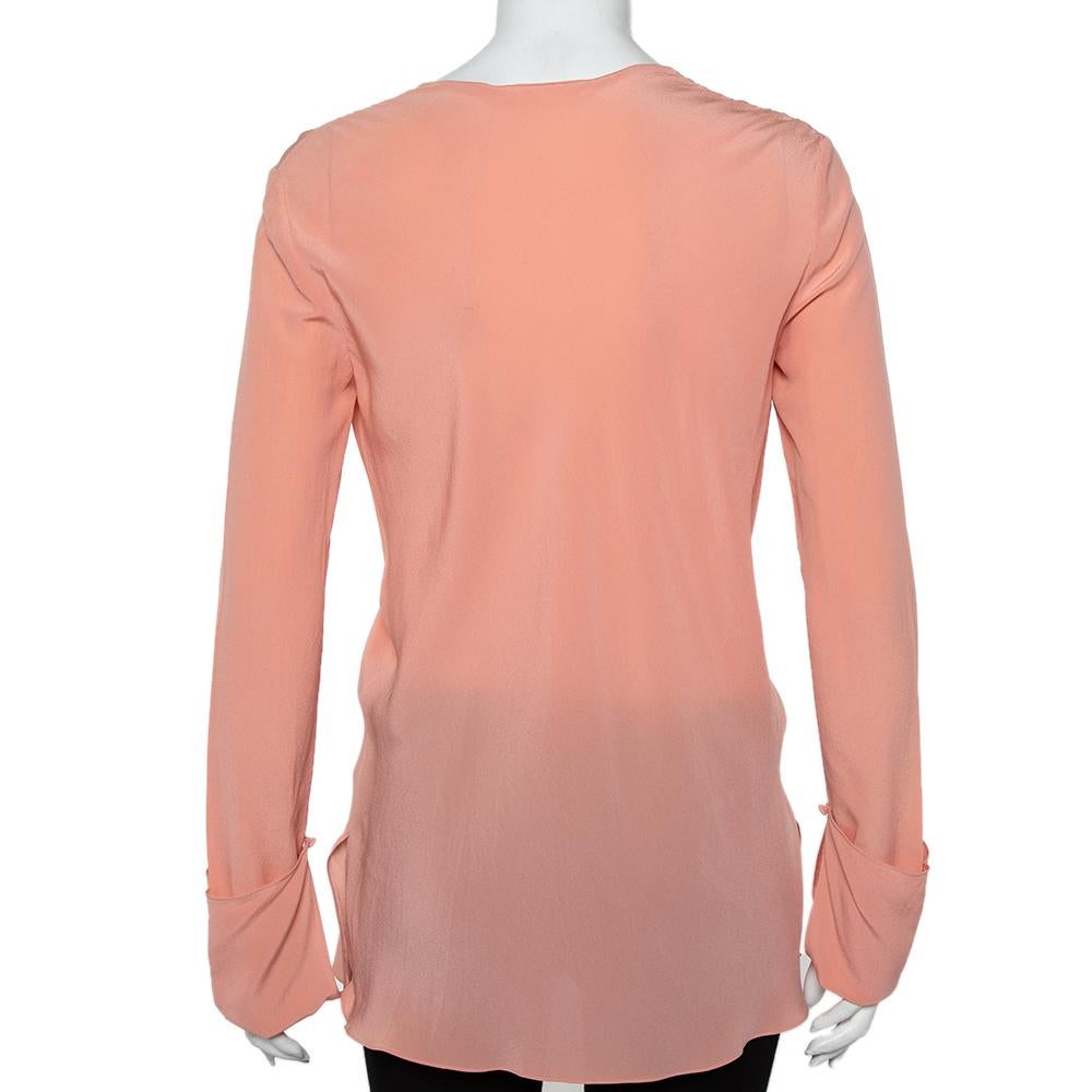 You must add this simple yet sophisticated blouse by Chloe to your understated closet now! Crafted with silk, it features a draped neckline, well suited long sleeves and a flattering fit.

