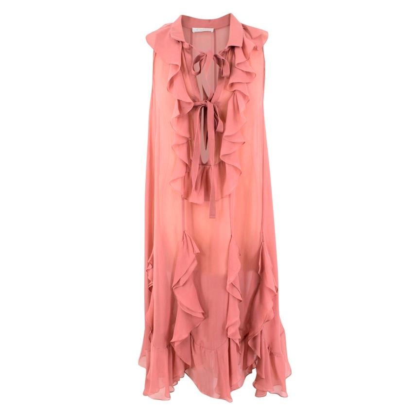 Chloe Pink Silk Ruffled Midi Dress

-Pink silk dress with ruffles
-Bows on the back to fasten
-Ruffled Hem
-Dress comes with a slip

Please note, these items are pre-owned and may show signs of being stored even when unworn and unused. This is