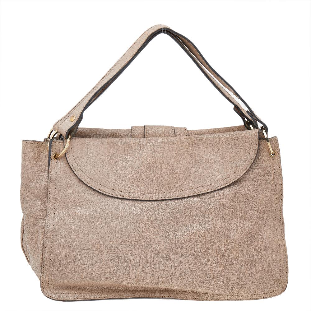 Stunning in appeal and simple in design, this satchel by Chloe will be a valuable addition to your closet. Crafted from textured leather, the bag features flat handles. The flap closure opens to a spacious fabric-lined interior to hold all your