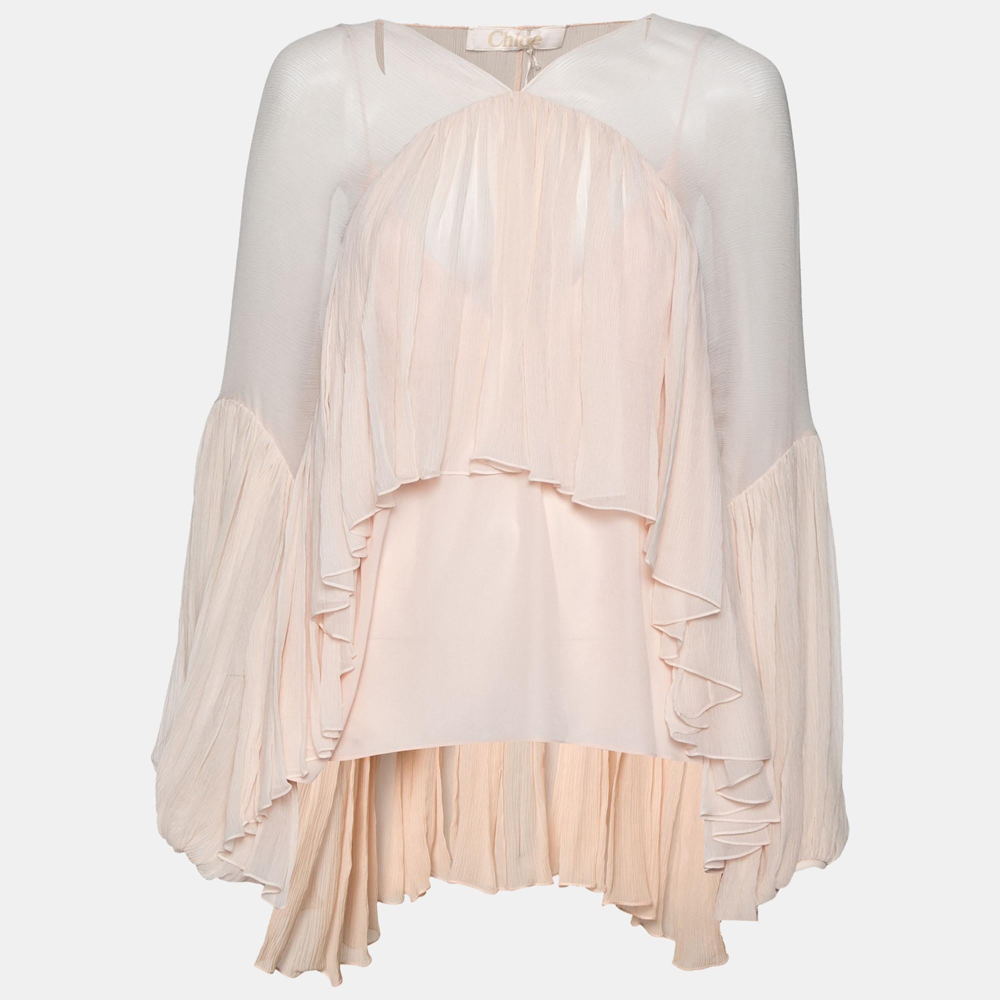 This blouse from Chloe is stitched from silk into an asymmetrical design and is truly pretty. The powder pink blouse has a gathered silhouette and long sleeves. Pair it with skinny jeans to achieve a balanced outfit.

Includes: Price Tag