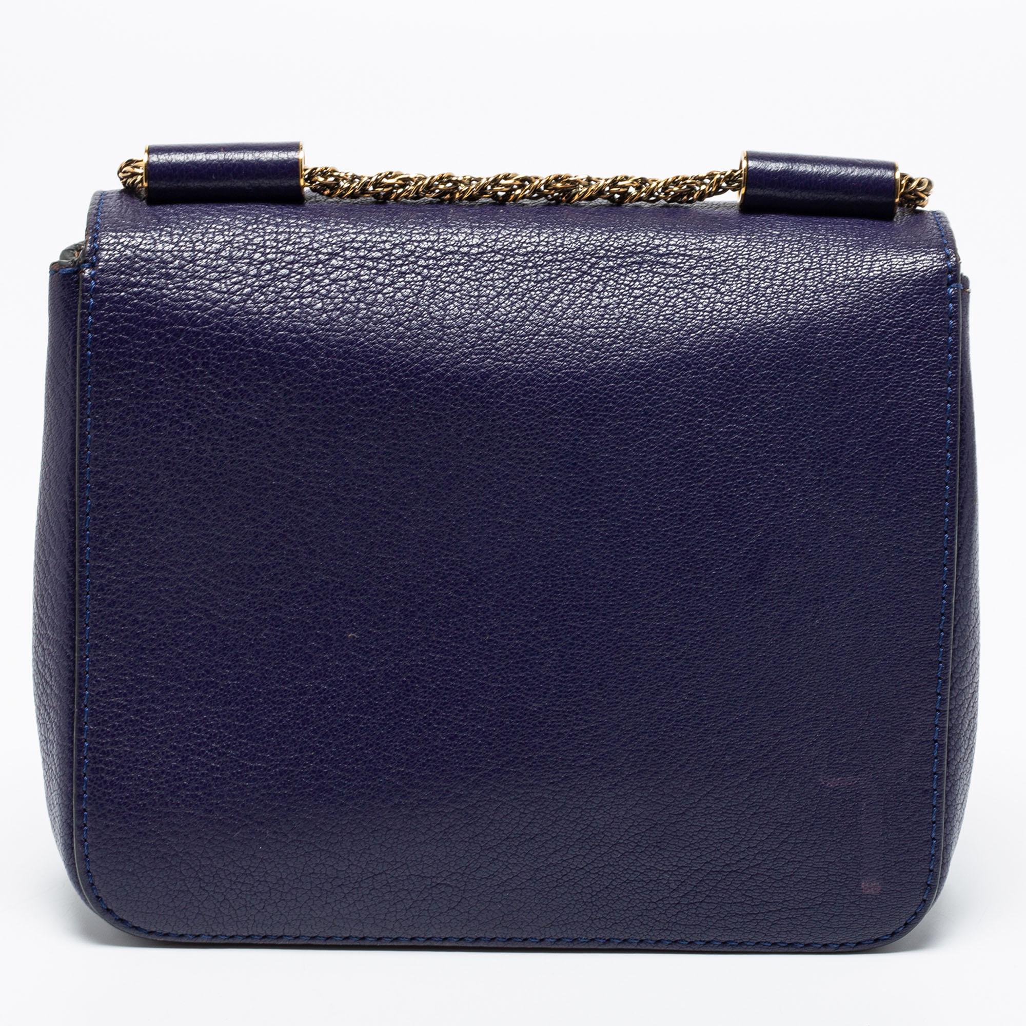 Every well-executed detail contributes to making this Chloe Elsie bag an exceptional design. Made from leather, its front flap is equipped with a notable branded turn-lock closure, and the gold-tone accents add to its charm. The leather interior of
