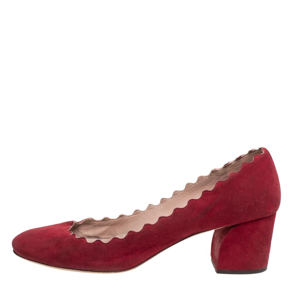 These red Lauren pumps from Chloe are sure to fetch you admiring glances every time you step out in them! They have been crafted from suede and styled with almond toes and scalloped trims that look dainty and feminine. They come equipped with