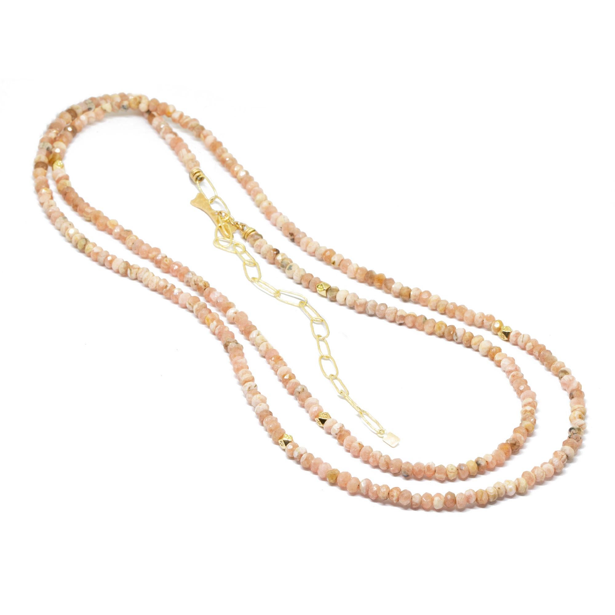 The best part about our Chloe Gold Gemstone Convertable Wrap isn’t just that it can be worn long, doubled-up, or as a wrap bracelet (although that’s pretty cool). It’s that you can thread any of our Charms onto the rhodochrosite beads—have fun