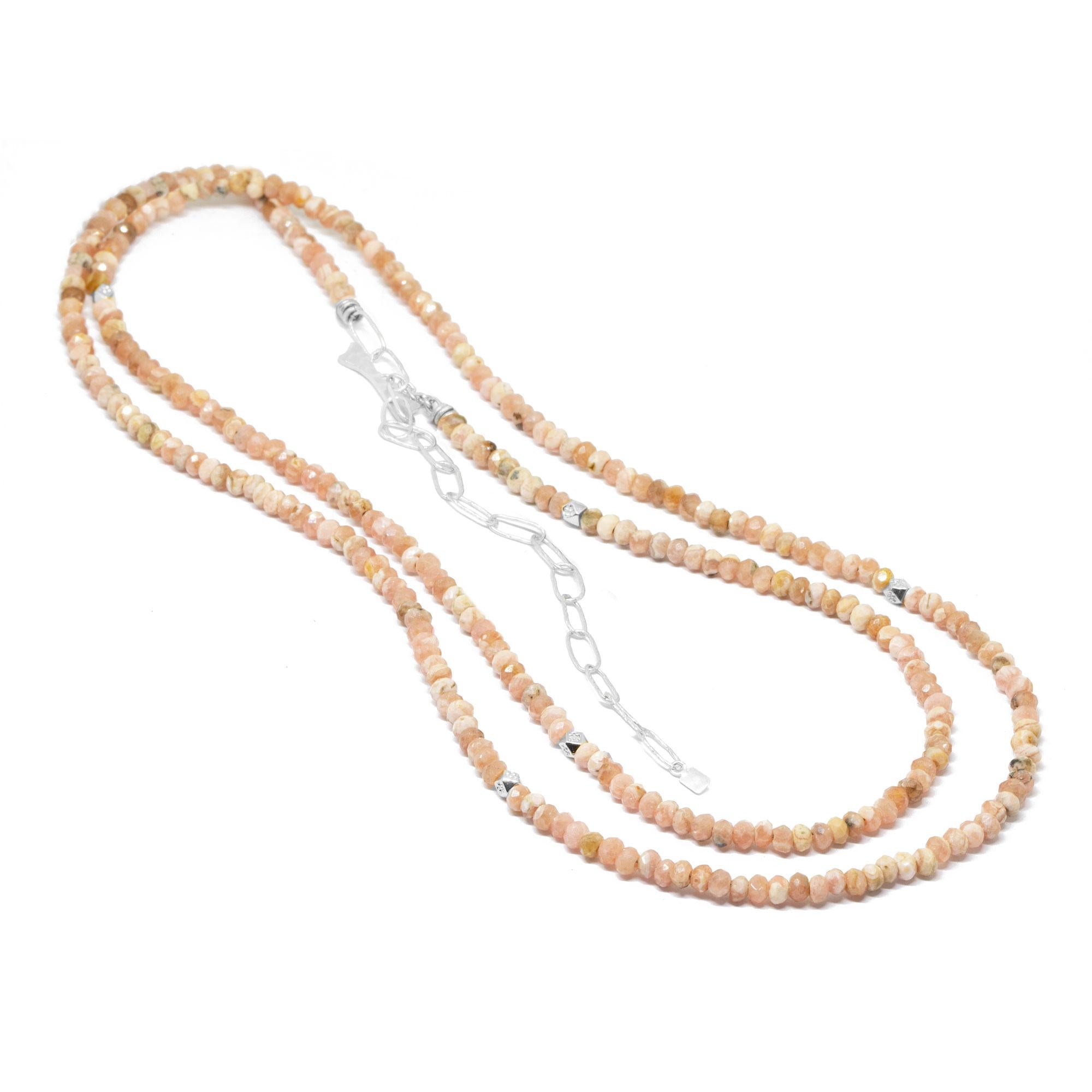 The best part about our Chloe Silver Gemstone Convertable Wrap isn’t just that it can be worn long, doubled-up, or as a wrap bracelet (although that’s pretty cool). It’s that you can thread any of our Charms onto the rhodochrosite beads—have fun