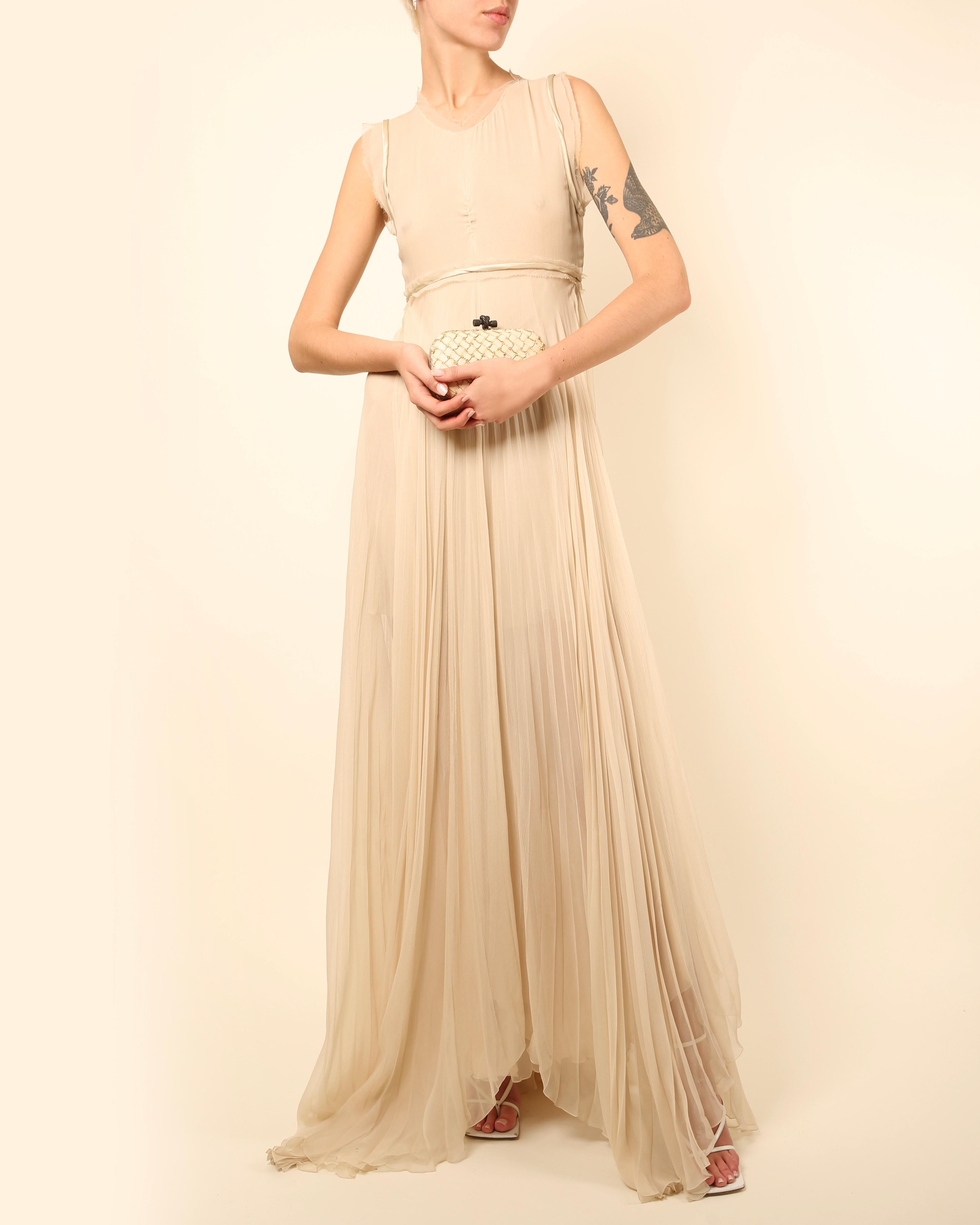 LOVE LALI Vintage

Look 29 from the Chloe Spring Summer 2010 runway collection
Floor length silk gown in what one would call off white/ecru, or a very pale beige
Sleeveless cut with raw cut edges
Satin trim to the arm holes and waist
Layered plisse