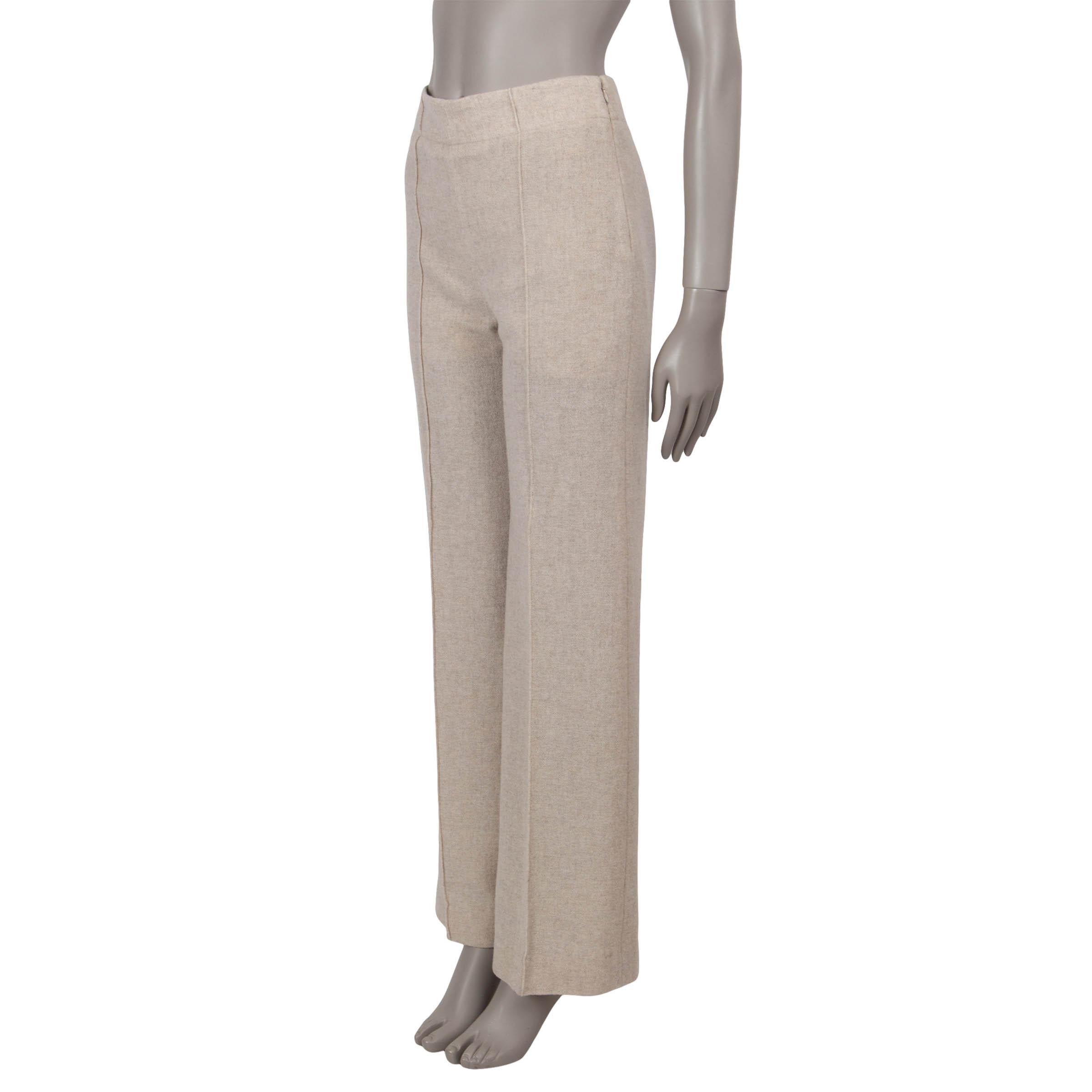 This 100% authentic Chloé pants in Sandy Khaki beige gauzy recycled wool (50%) and cashmere (50%) exude effortless elegance. Designed with a high-waisted silhouette, they feature creased wide legs. They open with a concealed hook and zipper on the