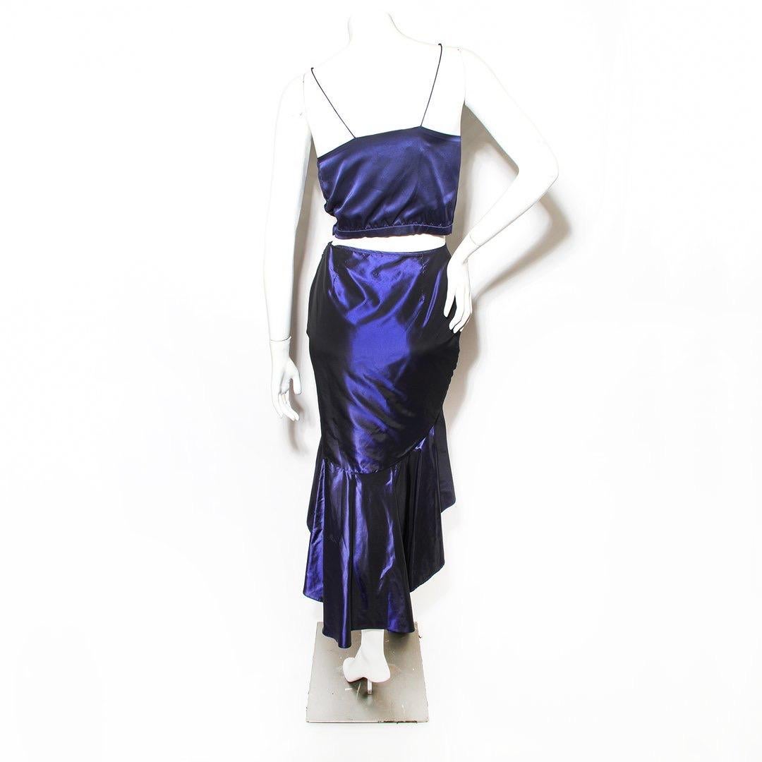 Satin two-piece by Chloe
Cropped top and skirt
Navy
Side snap closure on top
V-neck front with rhinestone detail
Spaghetti strap
Cropped length
Asymmetrical hem 
Pleated bottom
Side zip closure on skirt
Condition: Great condition, small stain on