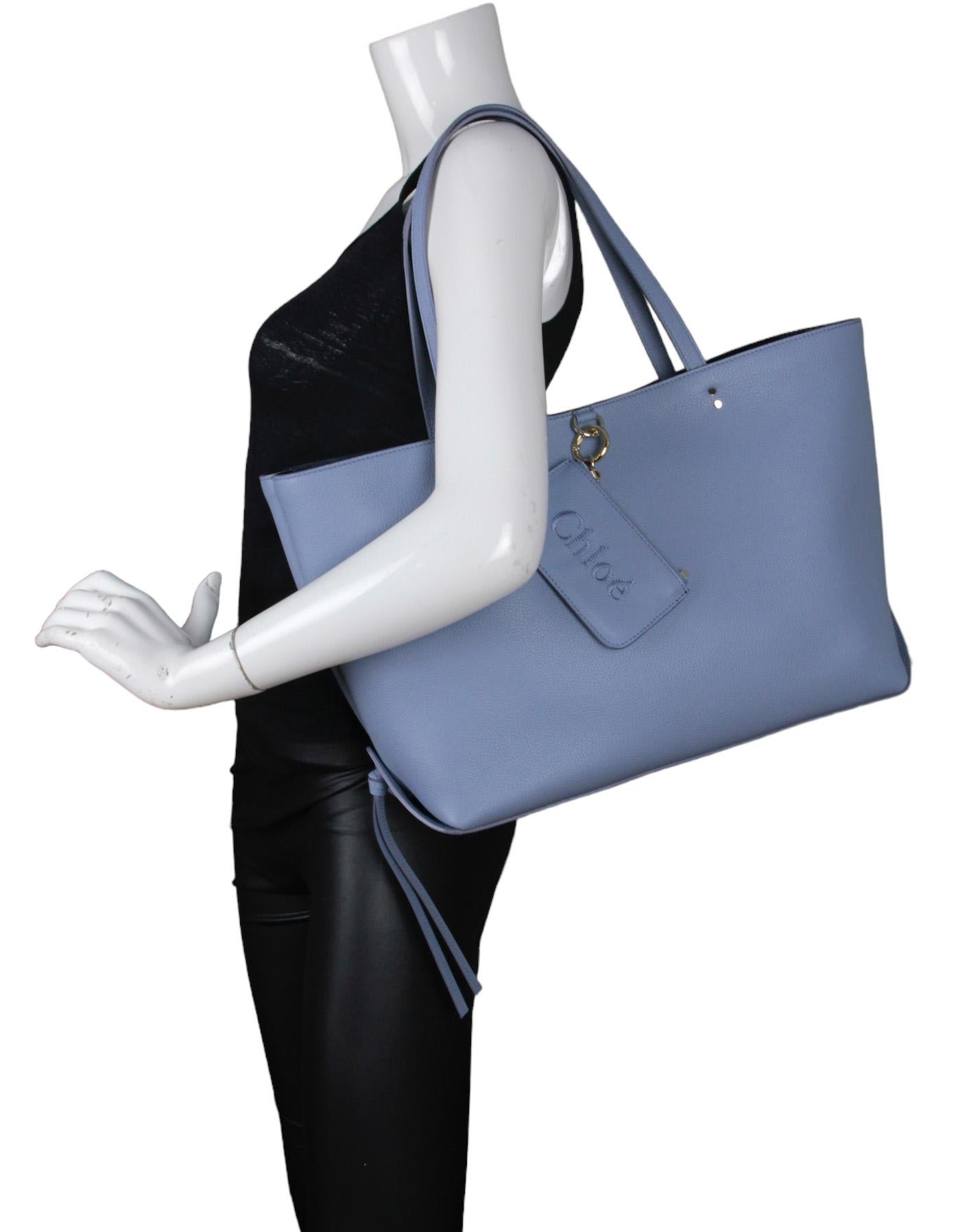 Chloe Shady Cobalt Blue Calfskin Leather Sense Tote Bag

Made In: Italy
Color: Shady cobalt blue
Hardware: Pale goldtone
Materials: Grained calfskin leather
Lining: Suede lining
Closure/Opening: Open top
Exterior Pockets: Detachable zip