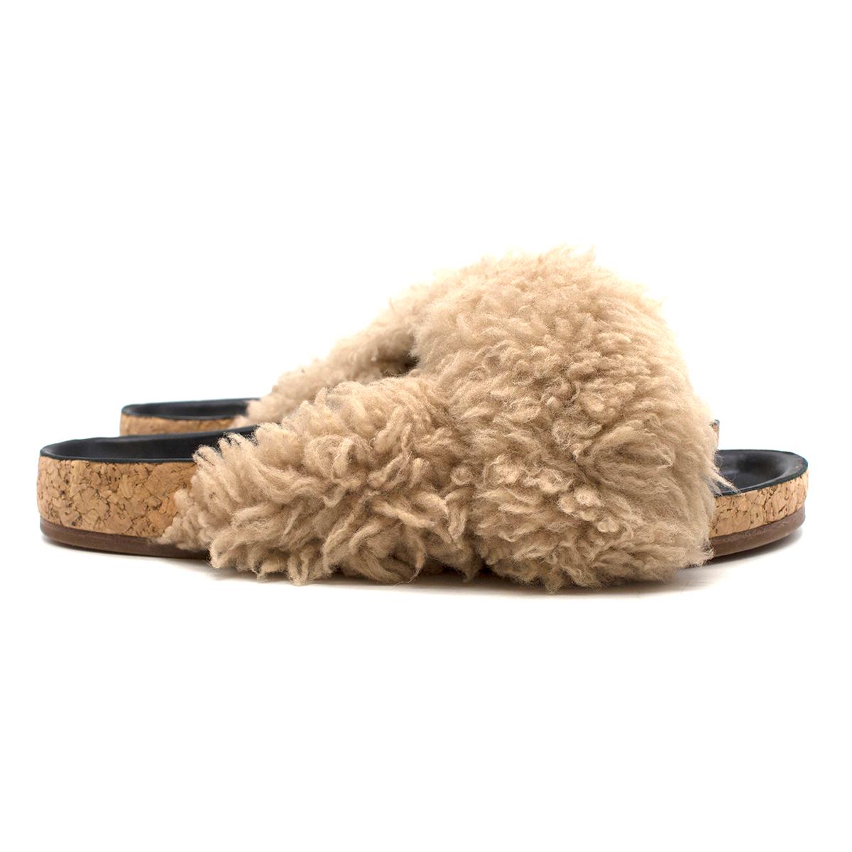 Chloe Shearling Fur Flat Slide Sandal

-Shearling slides
-Flat cork soles
-Open toe
-Leather insole

Please note, these items are pre-owned and may show signs of being stored even when unworn and unused. This is reflected within the significantly