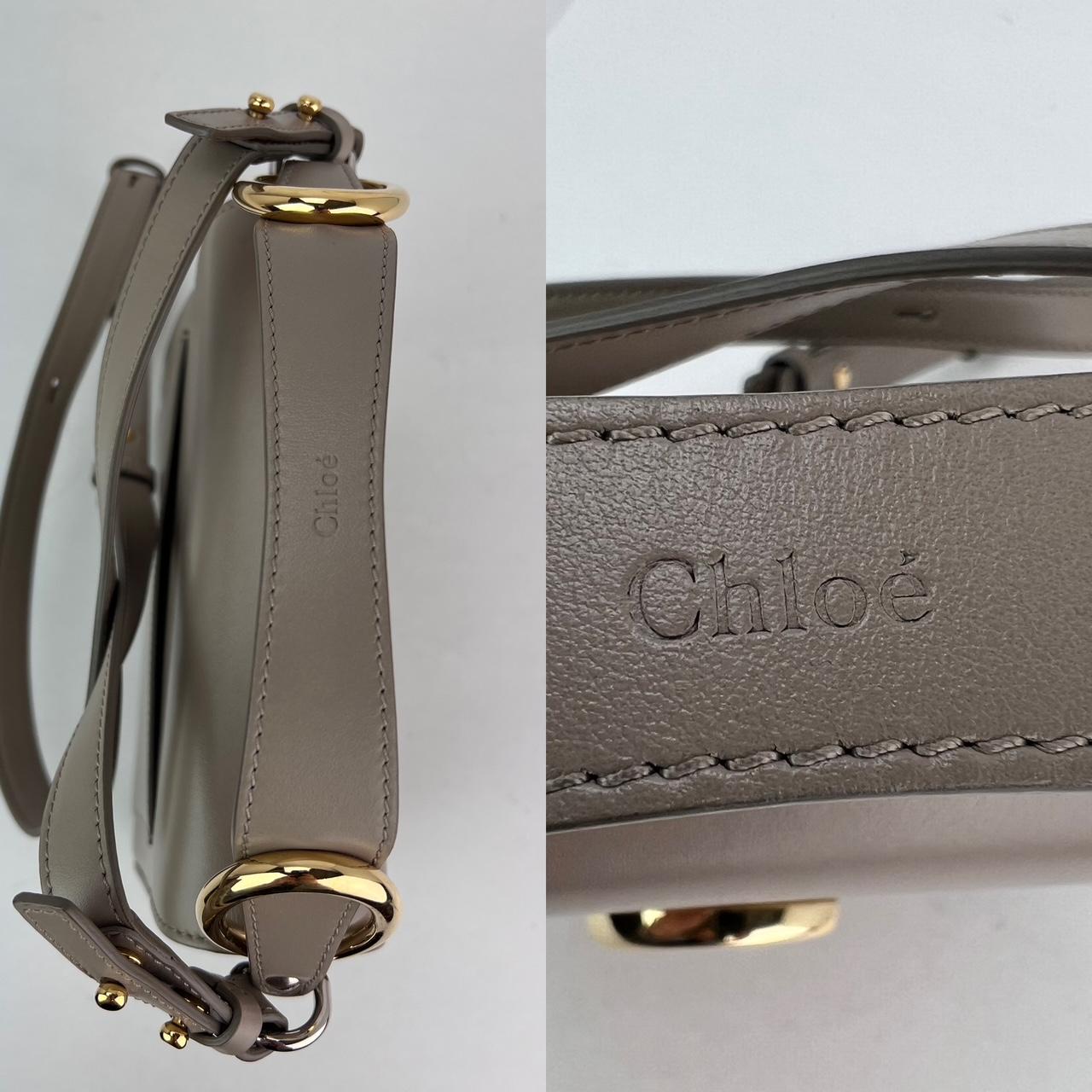 

Chloe Shiny Calfskin Suede Small C Motty Gray Shoulder Bag
Discover the perfect blend of style and functionality with the Chloe Shiny Calfskin Suede
 Small C Motty Gray Shoulder Bag. This versatile accessory is designed to elevate your everyday