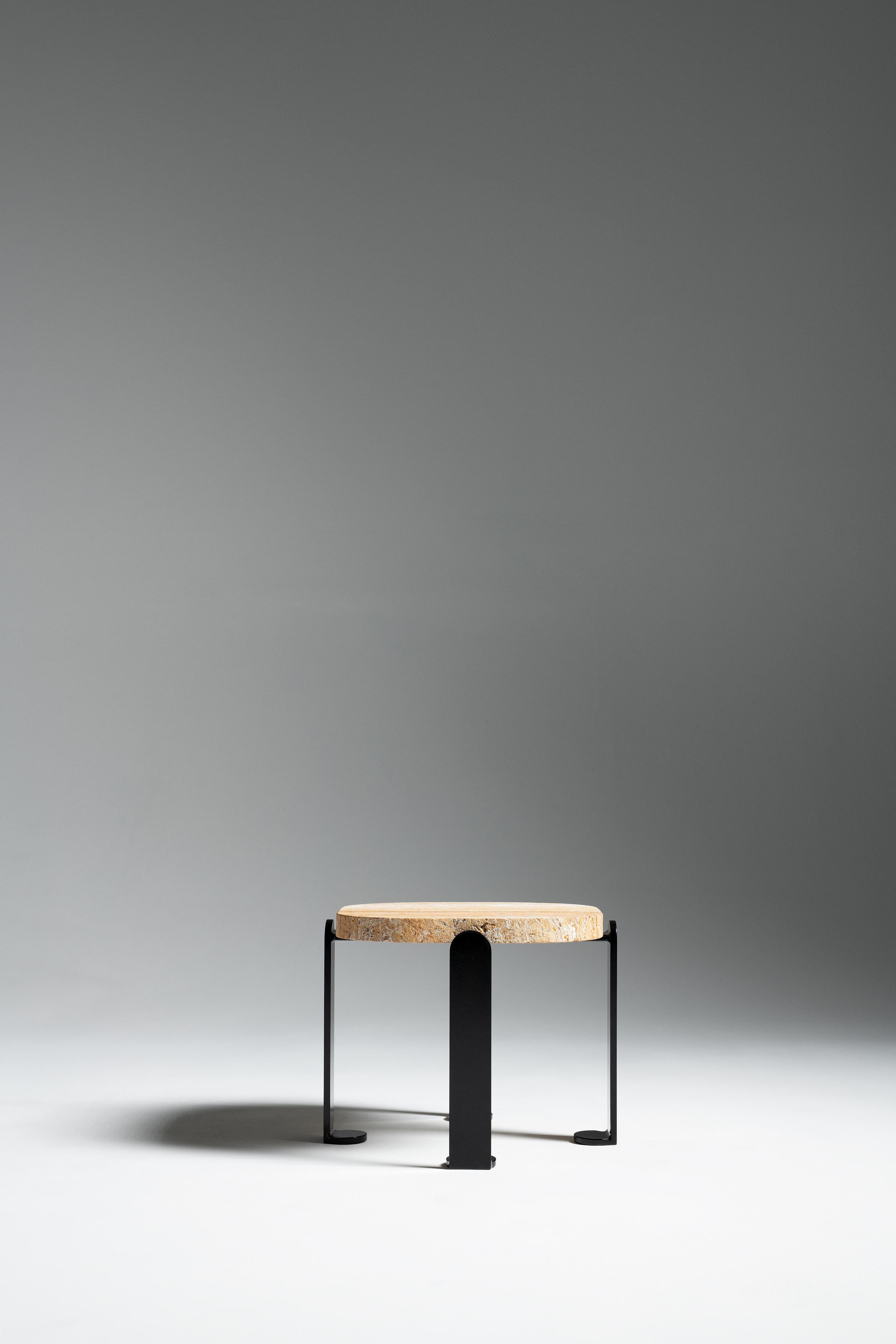 Chloe side table Travertine, Memphis, France, Le Berre Vevaud
Empreinte Collection
Steel base, glossy black lacquered finish
Solid walnut travertine tray, sandblasted brushed finish

For their second collection, Raphaël Le Berre and Thomas