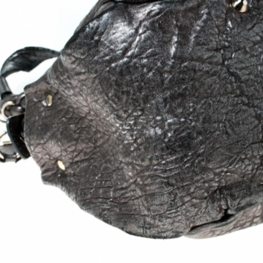 Chloe is known for quality craftsmanship in its designs and this satchel is a fine example. This elegant bag has been crafted from leather into a beautiful structure. The bag is equipped with a spacious fabric interior and two braided handles. Get