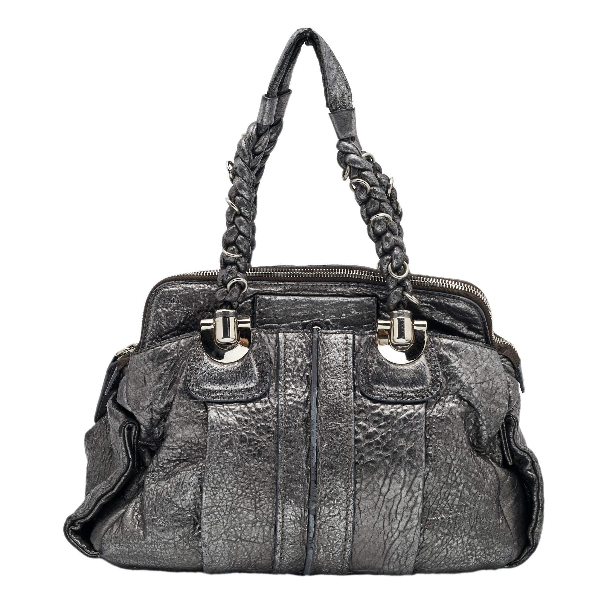 Chloe is known for quality craftsmanship in its designs and this satchel is a fine example. This elegant bag has been crafted from leather into a beautiful structure. The bag is equipped with a spacious fabric interior and two braided handles. Get