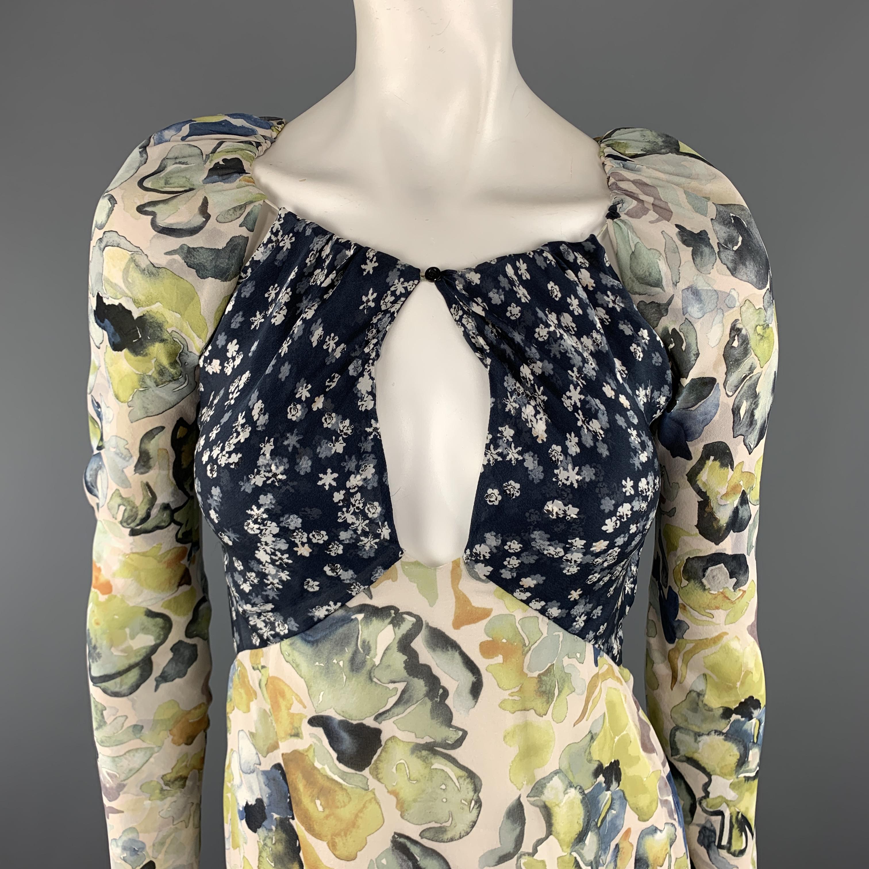 CHLOE dress comes in cream silk chiffon with green and yellow floral print with a gathered neckline, navy floral bust with cutouts, long sleeves, and A line skirt.  Made in France.

Excellent Pre-Owned Condition.
Marked: FR