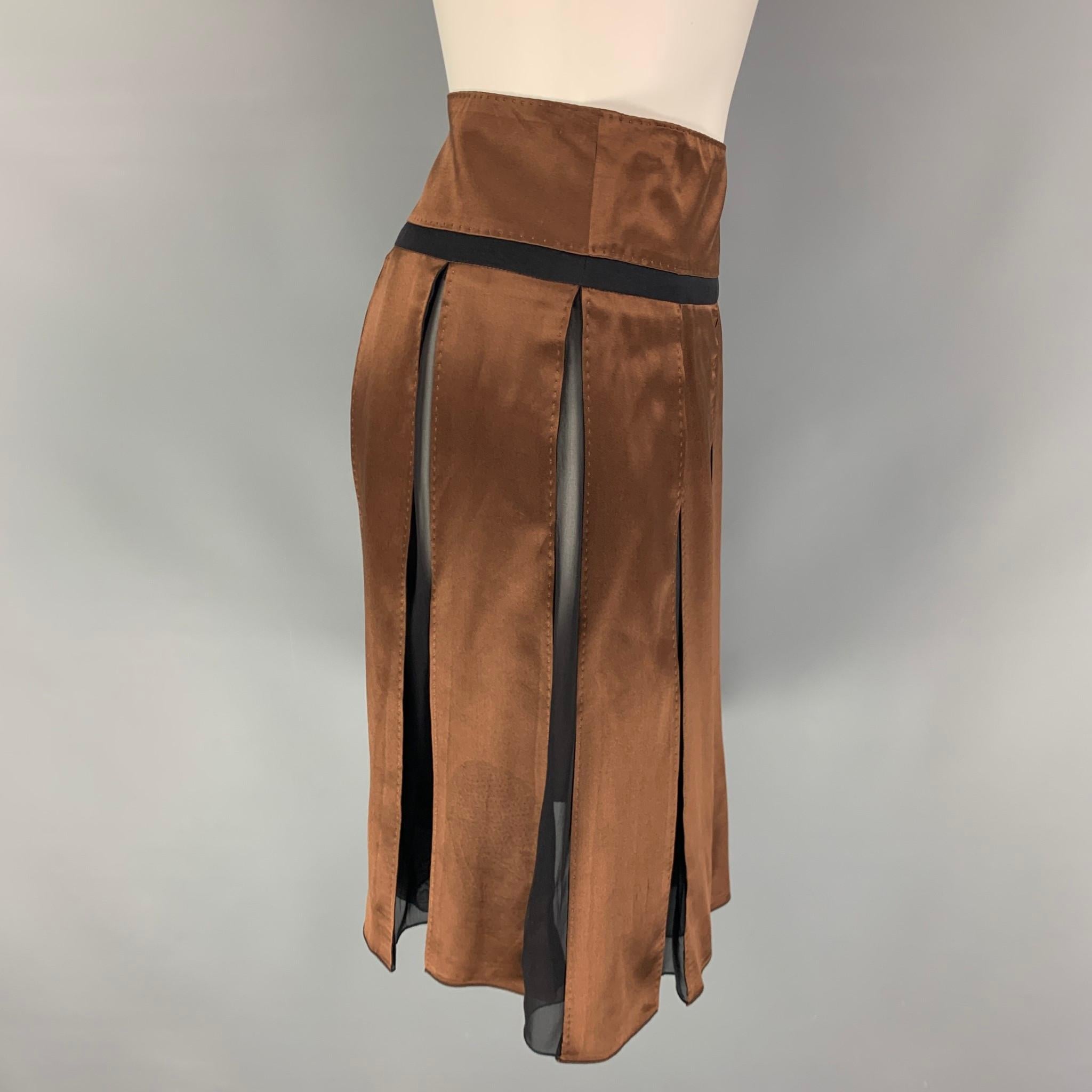 CHLOE skirt comes in a brown & black satin silk featuring a pleated style, high waisted, and a back zipper closure. Made in France. 

Very Good Pre-Owned Condition.
Marked: T 36

Measurements:

Waist: 28 in.
Hip: 32 in.
Length: 22 in.