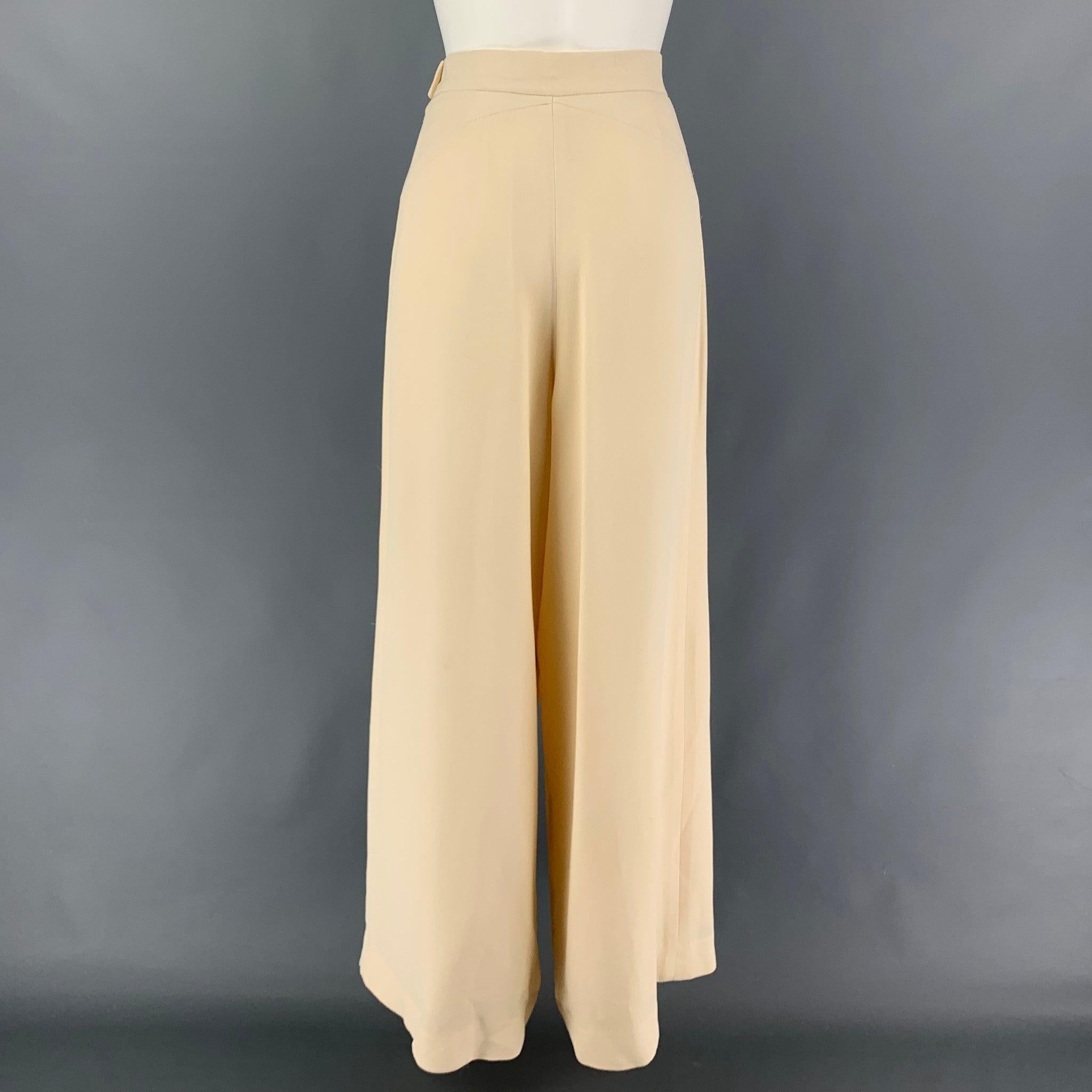 CHLOE dress pants comes in a cream silke featuring a wide leg style, high waist, top stitching, and a side zip up closure.
 Good
 Pre-Owned Condition. Light wear. As-Is.  
 

 Marked:  40 
 

 Measurements: 
  Waist: 28 inches Rise: 15.5 inches