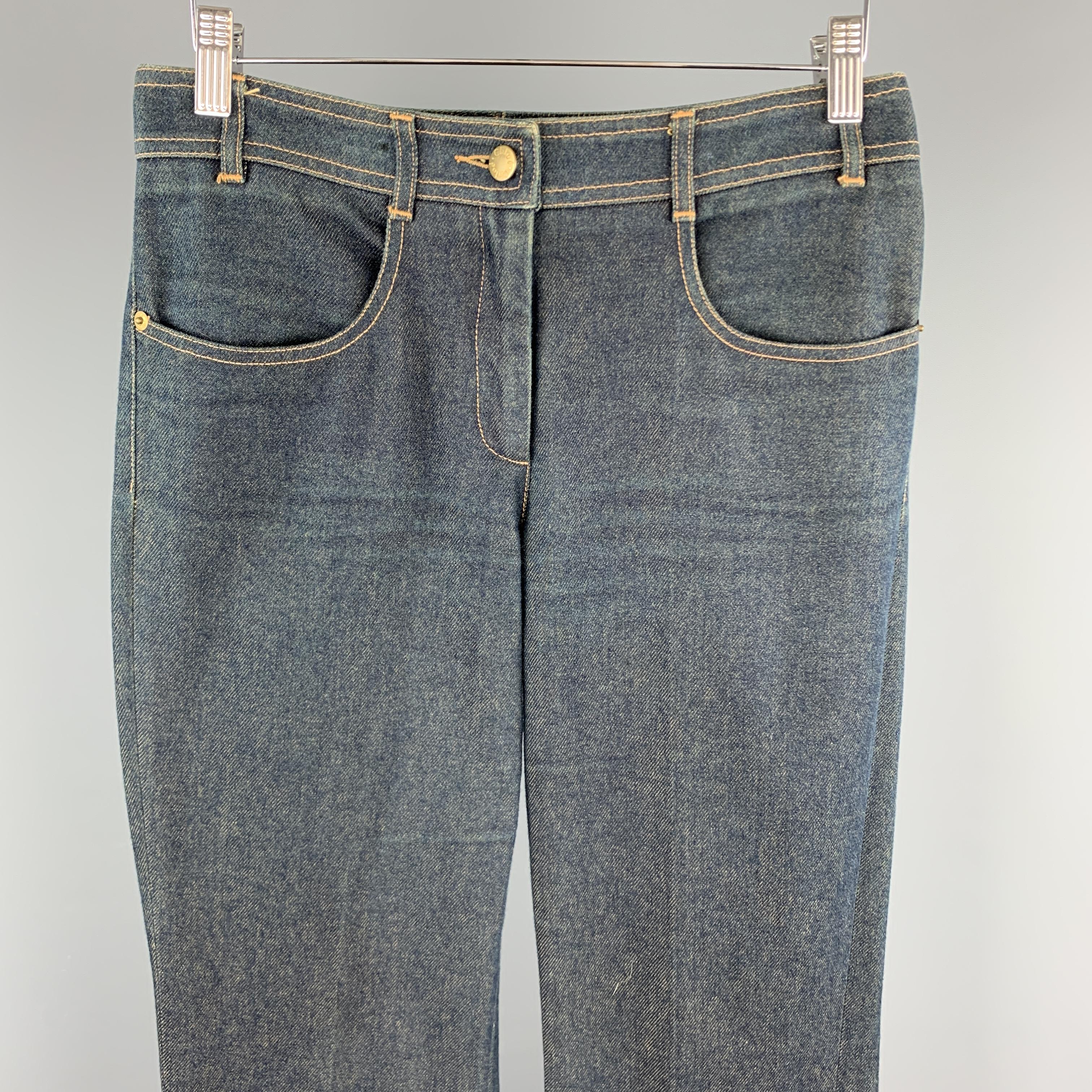 CHLOE jeans come in a dirty wash effect cotton denim with a high rise, retro fit, and bell bottom leg. Unhemmed. Made in France.

Excellent Pre-Owned Condition.
Marked: 30 in.
 
Measurements:

Waist: 30 in.
Rise: 10 in.
Inseam: 37 in.