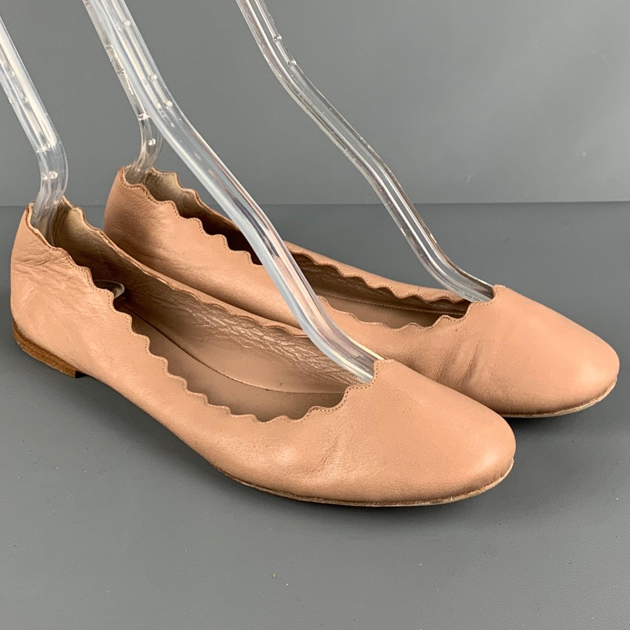 CHLOE LAUREN flats comes in a beige leather featuring a ballerina style, scalloped edges, and 0.3