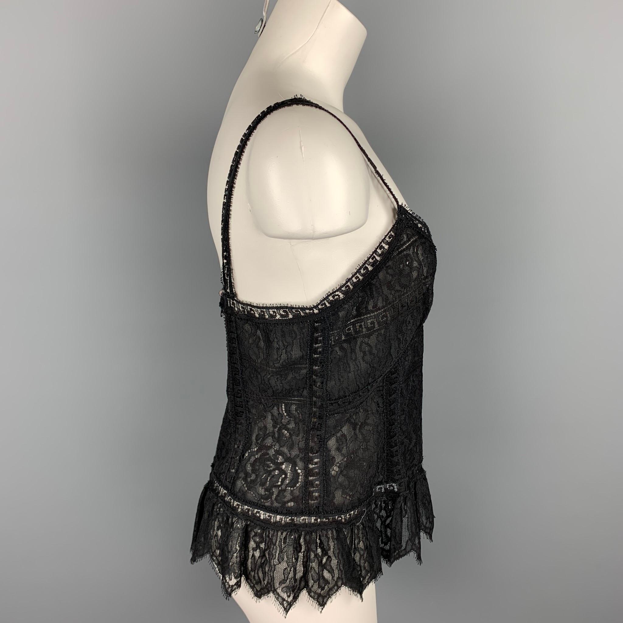 CHLOE camisole comes in a black lace material featuring a ruffled design and a back zip up closure. Made in France.

Good Pre-Owned Condition.
Marked: Size not visible

Measurements:

Bust: 32 in.
Waist: 32 in.
Length: 13.5 in. 