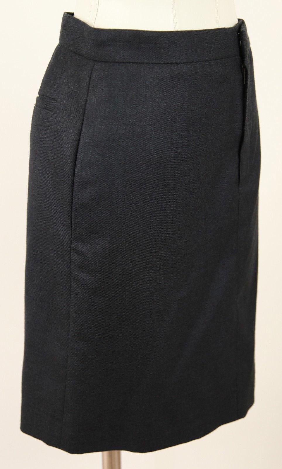 CHLOE 07A ICONIC BLACK STRAIGHT SKIRT

Color: Black

Fabric: Silk 52%, Wool 48%

Style: Straight above knee

Design:
- Flat front
- Front zipper and hook closure
- Covered side pockets
- Back slip pockets
- Fully lined

Size: 36
Measurements:
 -
