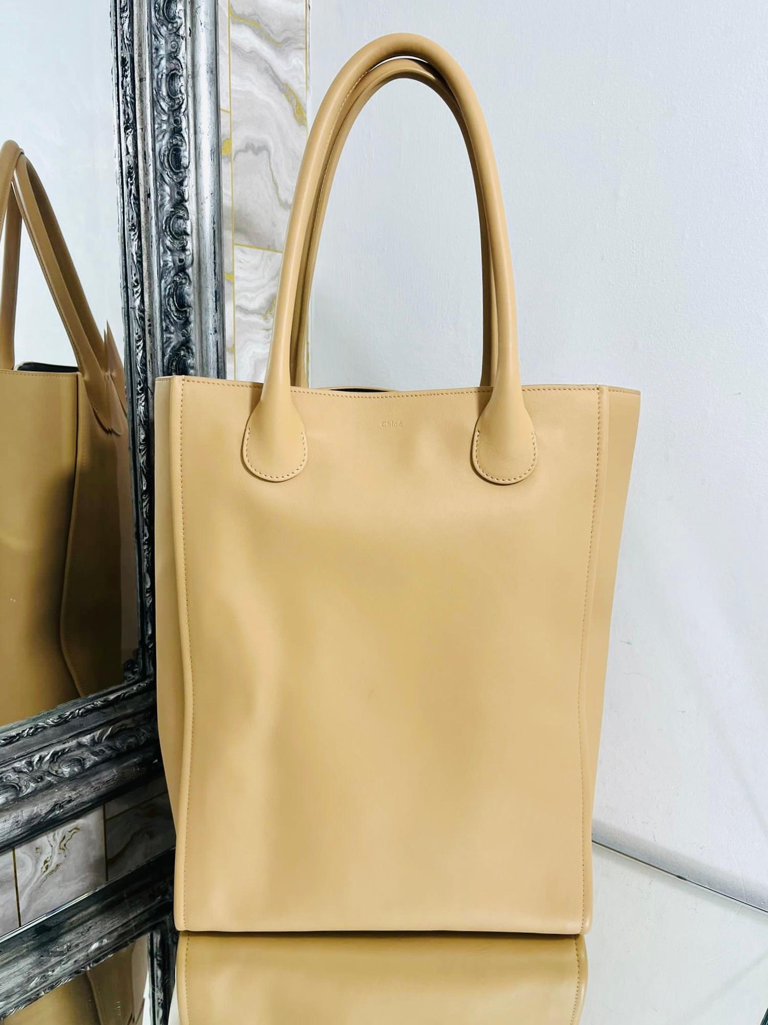 Chloe Soft Leather Tote Bag

Soft bodied shopper/tote bag in pale beige leather.

Embossed logo to the front.

Size - Height 40cm, Width 30cm, Depth 9cm

Condition - Very Good (One small mark to the leather)

Composition - Leather 

Comes With - Bag
