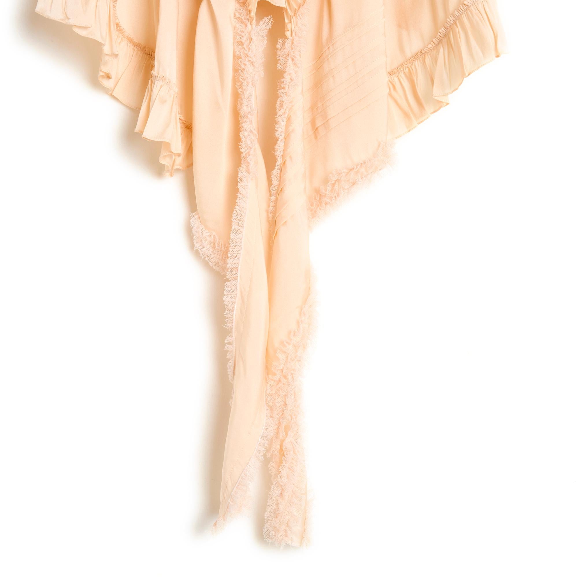 Top Chloé Spring Summer 2018 collection (by Natacha Ramsay-Levy) in apricot-colored silk twill, flared shape, deep V-neckline at front edged with a micro tulle ruffle and a long pleated ruffle, pleated and pique bib, highlighted shoulders with