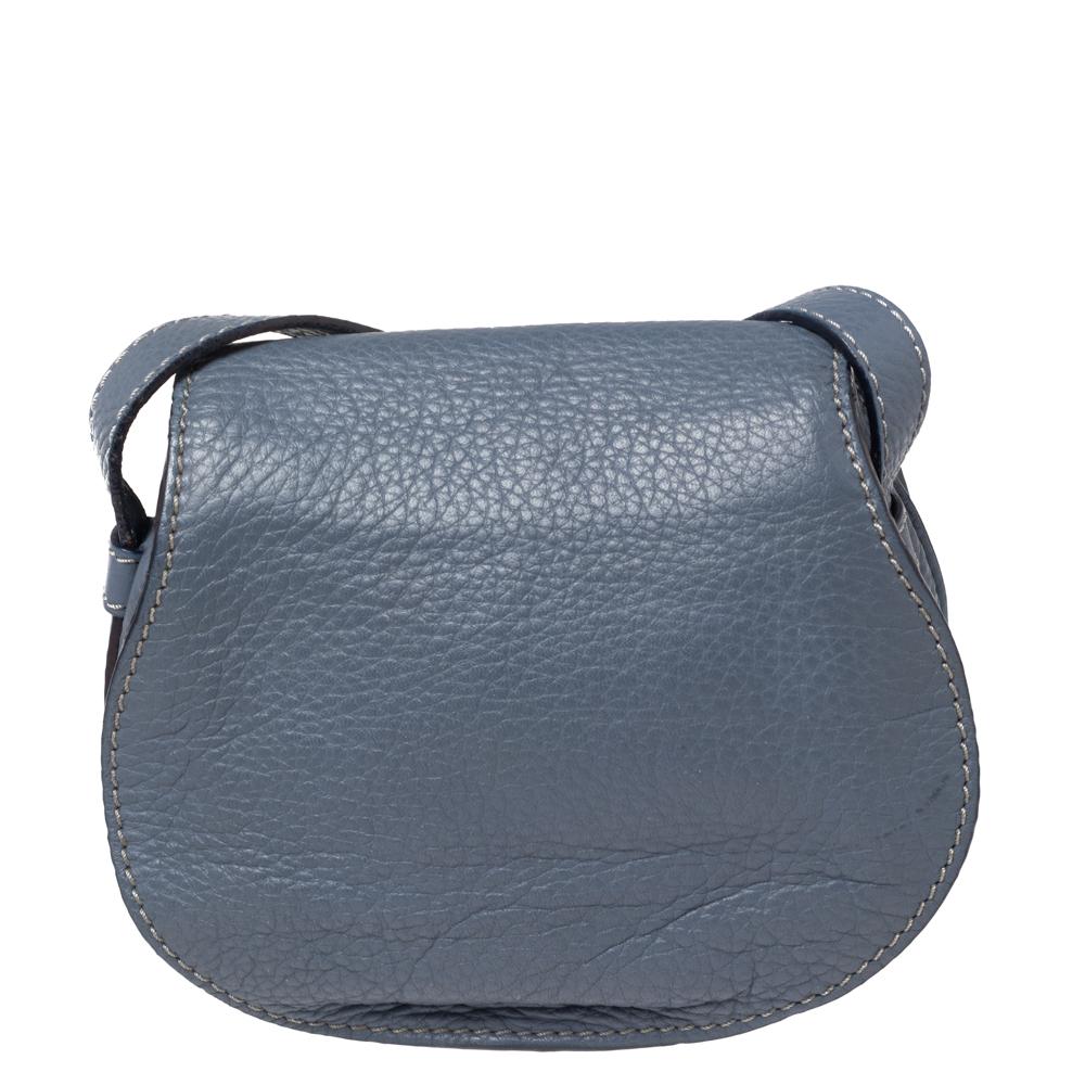 Stunning to look at and durable enough to accompany you wherever you go, this Chloe bag is a joy to own! This Marcie bag is crafted from leather with a shoulder strap. The insides are canvas lined and perfectly sized to carry your