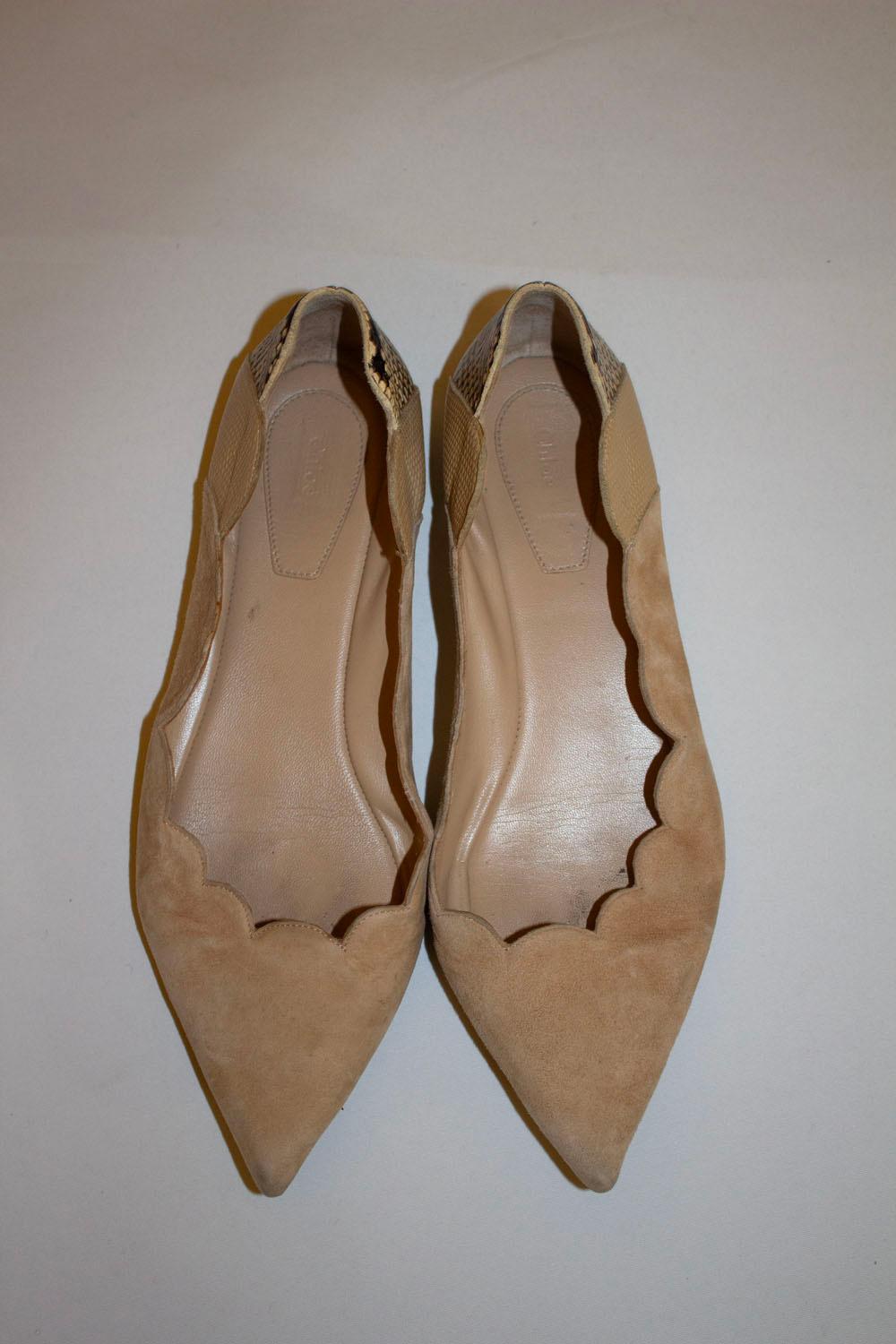 A great pair of flat pumps for Spring by Chloe. The shoes are in a light beige suede with snakeskin heel back. The have leather soles. Size 38 1/2 . Made in Italy.