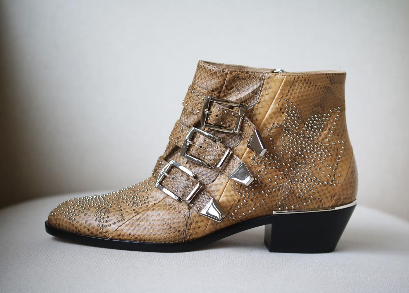 Chloé's 'Susanna' boots are one of the label's most sought-after designs. Updated in tonal-sand watersnake - a chic alternative to black and just as versatile - this pair is punctuated with silver studs and three buckled straps. Heel measures