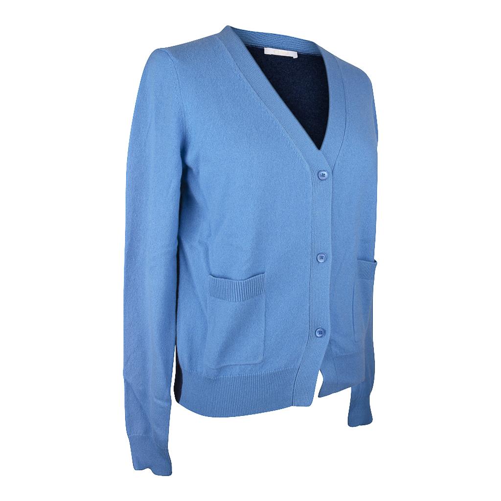 Guaranteed authentic Chloe cashmere V-neck cardigan sweater. 
V neck front button cardigan color blocked in 2 shades of blue.
The front is French blue and the back is dark blue. 
3 blue logo embossed buttons and 2 front patch pockets.
2 slot pockets