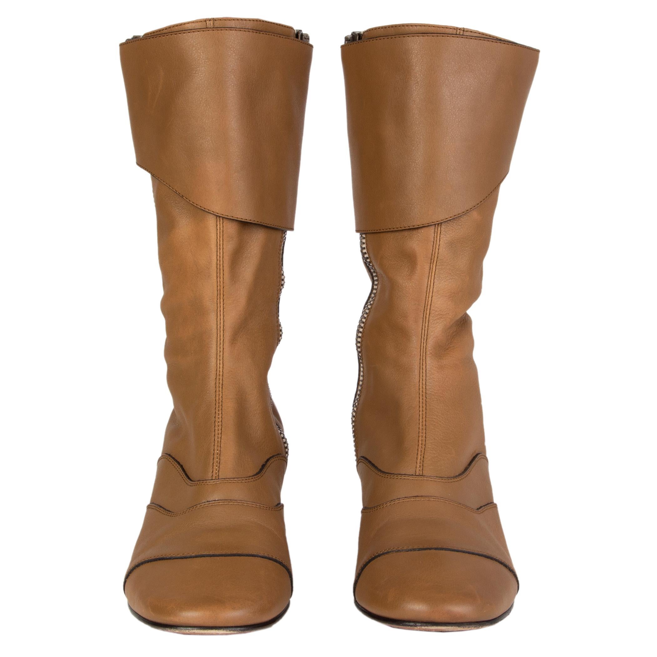 100% authentic Chloé mid-calf boots in beige leather with two zippers on the inside and outside featuring velcro flap closure. Have been worn and are in excellent condition. 

Measurements
Imprinted Size	39.5
Shoe Size	39.5
Inside Sole	26.5cm