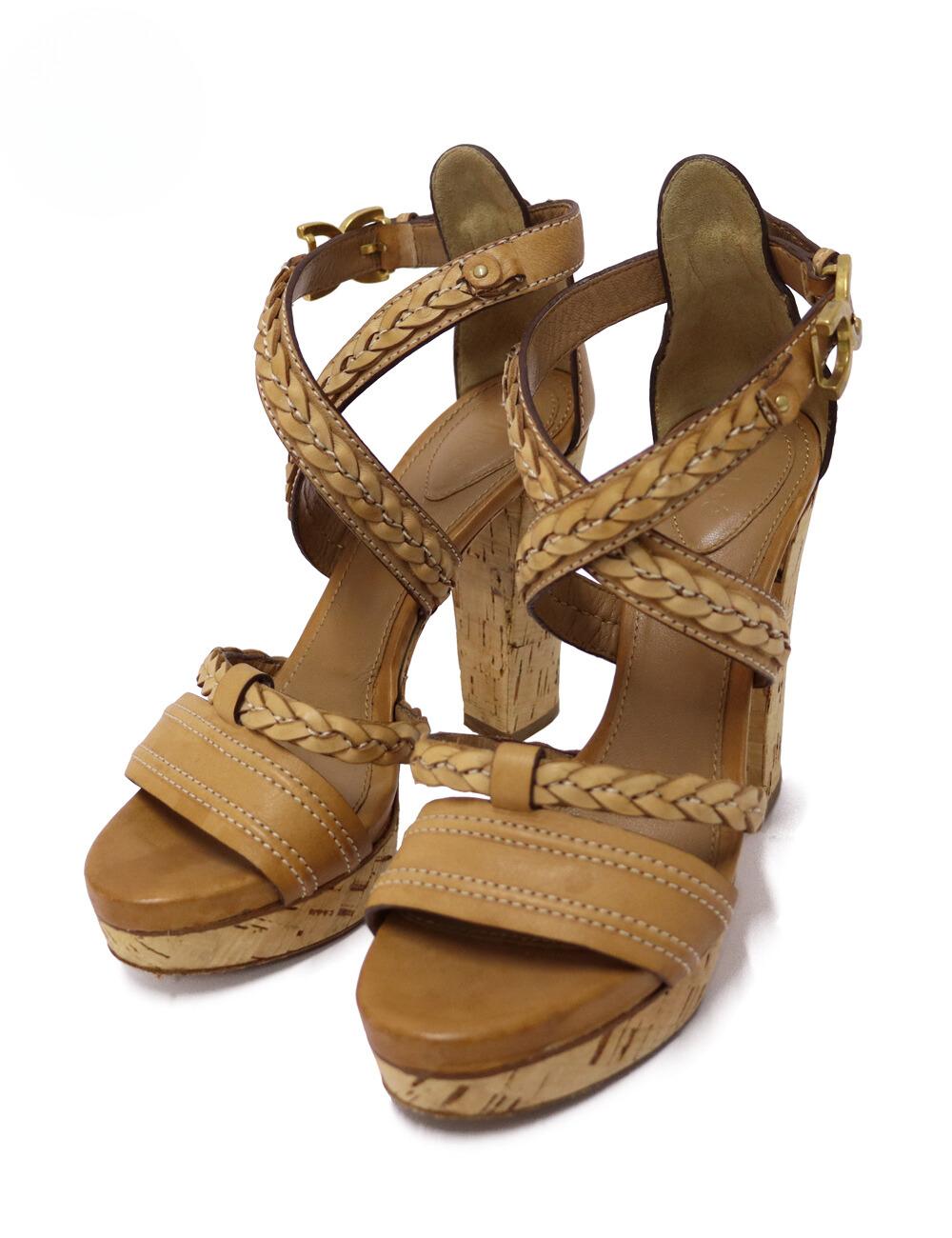 Chloé Tan Leather Braided Wooden Platform Sandals.

Material: Leather 
Heel Height: 11cm
Platform Height: 2cm
Size: EU 37
Overall Condition: Good.
Interior Condition: Visible signs of wear.
Exterior Condition: Visible stains.