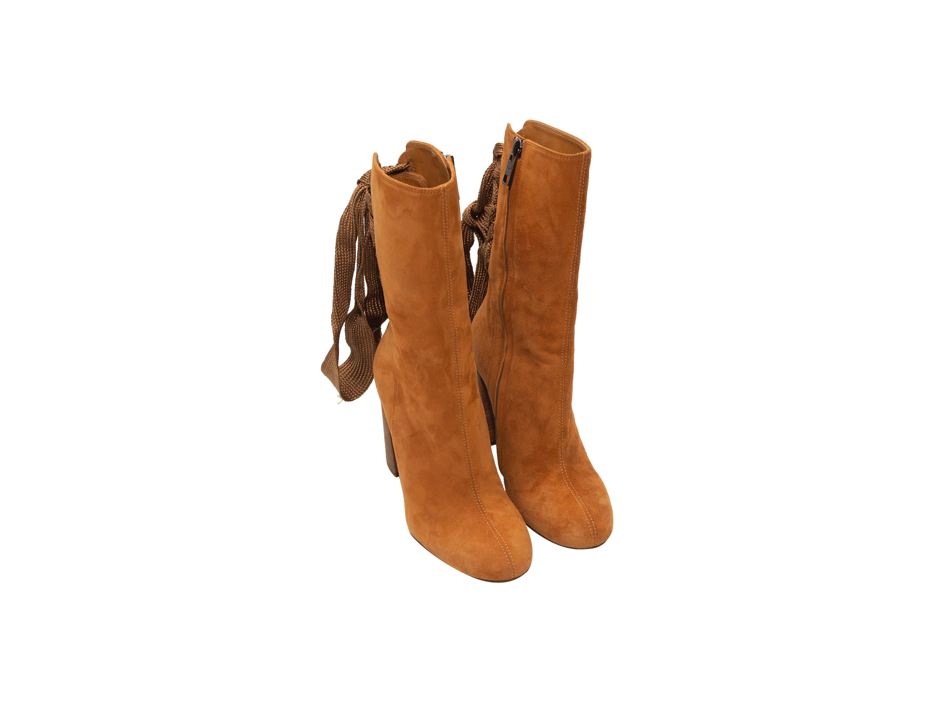 Product details: Tan suede round-toe Harper ankle boots by Chloe. Lace-up detailing at backs. Stacked heels. Zip closures at inner sides. Designer size 36. 3.5