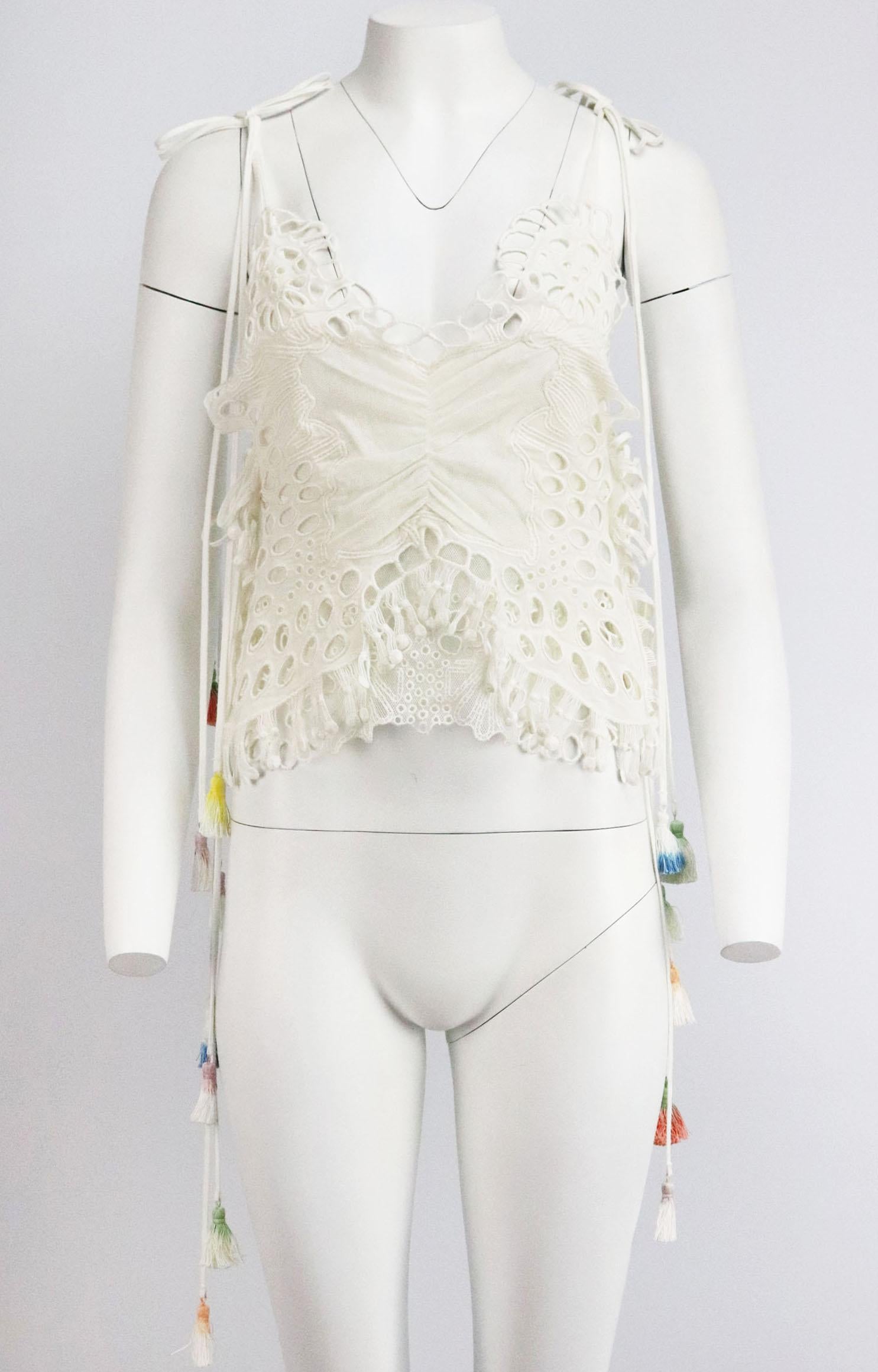 This beautiful top by Chloé is cut from layers of tulle and linen-blend and finished with butterfly broderie anglaise detail on the front, a key feature seen in Chloe's catwalk collection, it’s finished with multicoloured tassel tie-fastening along