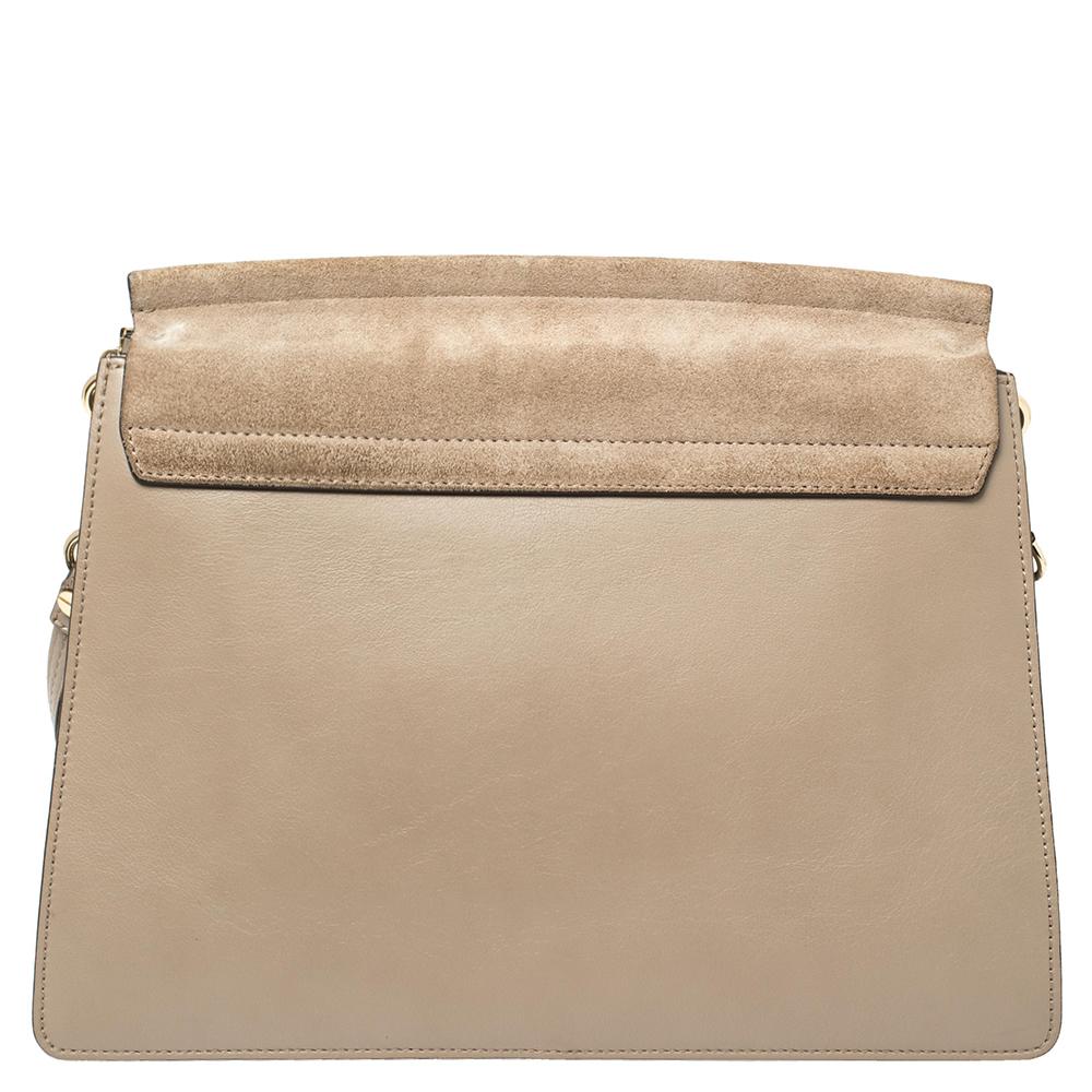 You are going to love owning this Faye shoulder bag from Chloe as it is well-made and brimming with luxury. The bag has been crafted from leather & suede and designed with a flap with a chain detail and well-sized suede compartments for your