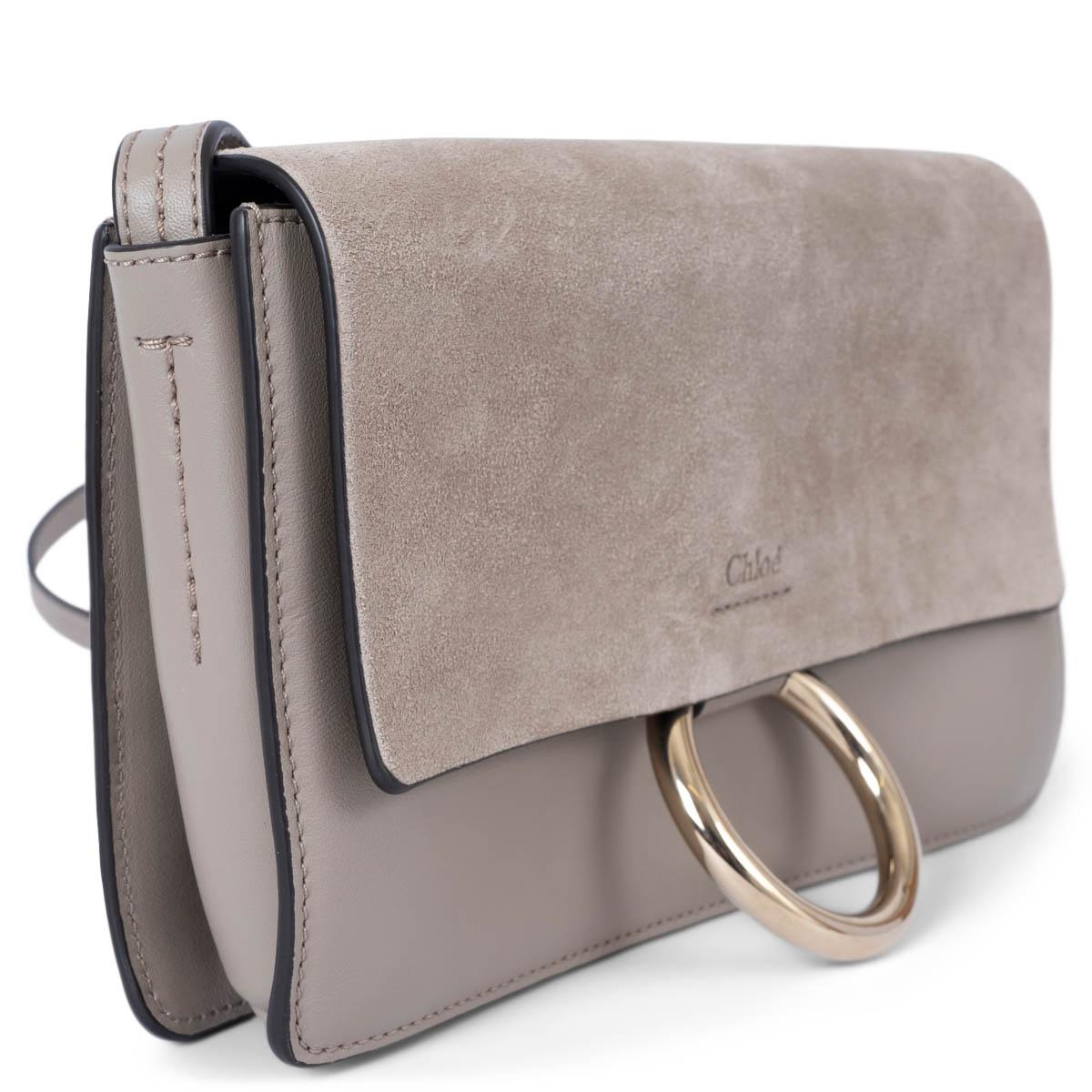 100% authentic Chloé Faye small crossbody bag in taupe leather featuring suede fold over flap. The design features light gold-tone hardware with a circular ring and snap button closure. The interior is lined in cream suede and divided in three