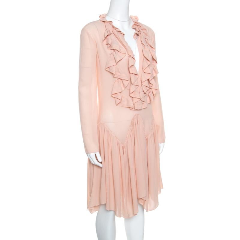 Beautiful to look at, this dress from Chloe has been created to suit your fashionable taste. It is made of quality silk and it has long sleeves, ruffle detailing and a gorgeous skirt that falls in a chevron pattern. Graceful and very modern, this