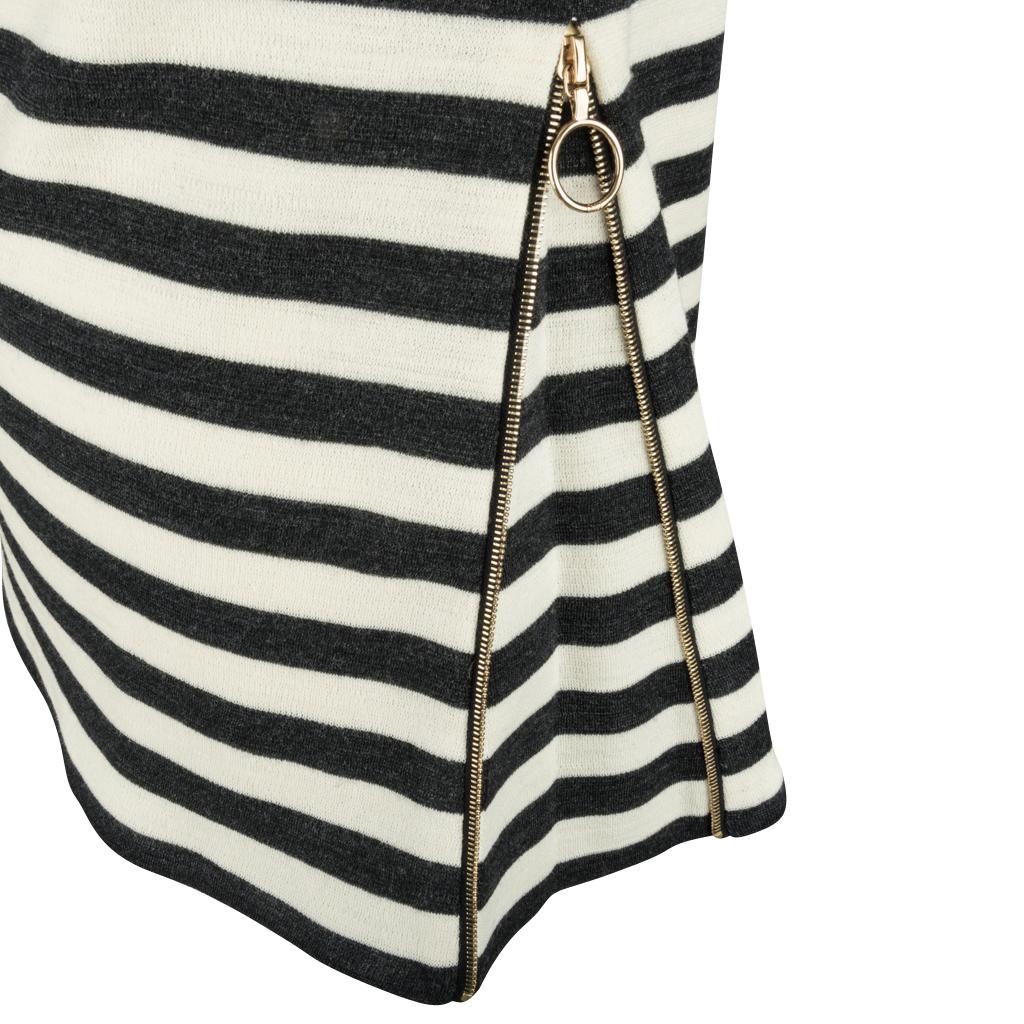 Guaranteed authentic Chloe striped wool top features dark grey graphite and vanilla stripes.
Fold over turtleneck.
Left side has a working gold zip with round toggle.
Zip open to release more fabric for a different look! 
NEW or NEVER WORN.  Tags