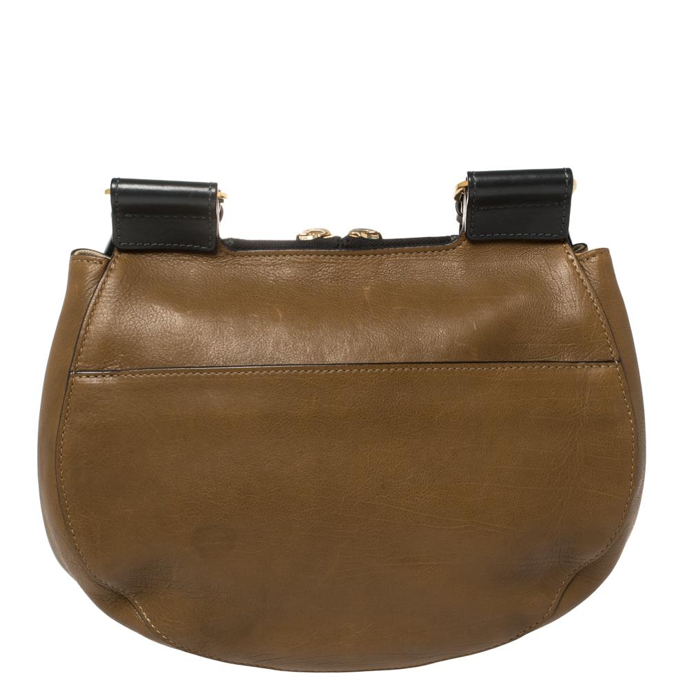 One of the most recognizable bags in the luxury world, Chloe's Drew bag was part of the label's fall/winter 2014 collection. This tricolored Drew carries a distinct saddle shape and minimal style detailing. This shoulder bag has been meticulously