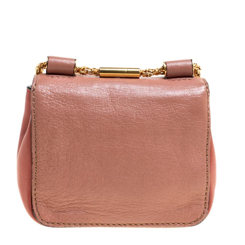 Every detail on this Chloe Elsie bag is magnificent which makes the creation worthy of being owned. It has been crafted from leather and styled with a flap. The bag is secured by a turn-lock revealing a fabric interior and completed with a crossbody