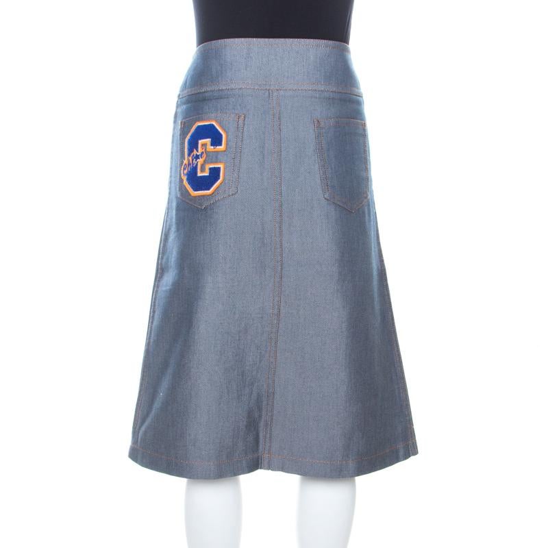 If you are a fashionista who loves to be a step ahead of their sensation game, this navy blue skirt will work well for you. Tailored from cotton and silk, the high waist skirt is adorned by a brand logo patch on the back pocket. It comes with two