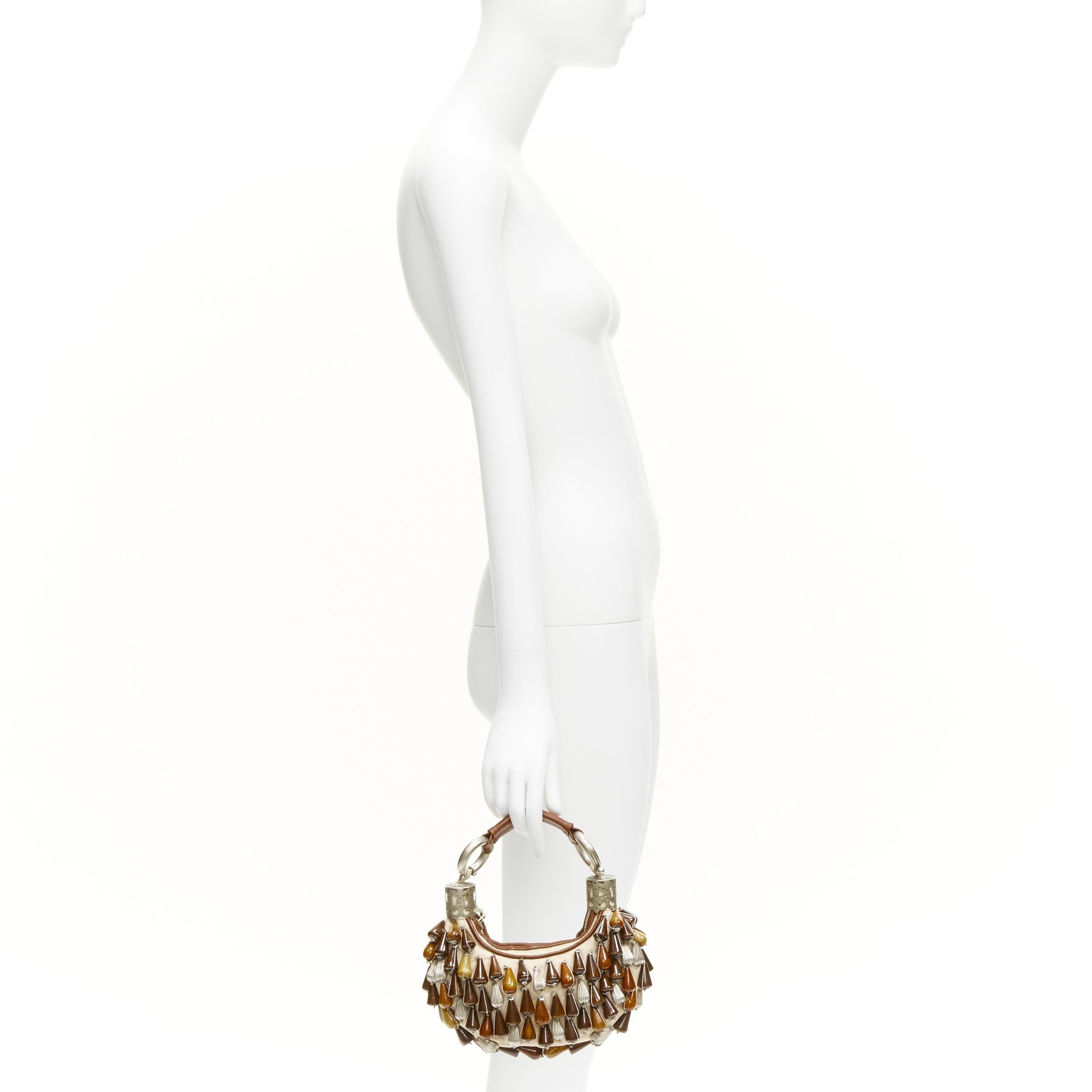 CHLOE Vintage wood metal beads embellished leather boho small hobo bag
Reference: TGAS/C02063
Brand: Chloe
Material: Wood, Metal, Fabric
Color: Beige, Brown
Pattern: Solid
Closure: Zip
Lining: Beige Fabric
Extra Details: Chunky zip closure.
Made in: