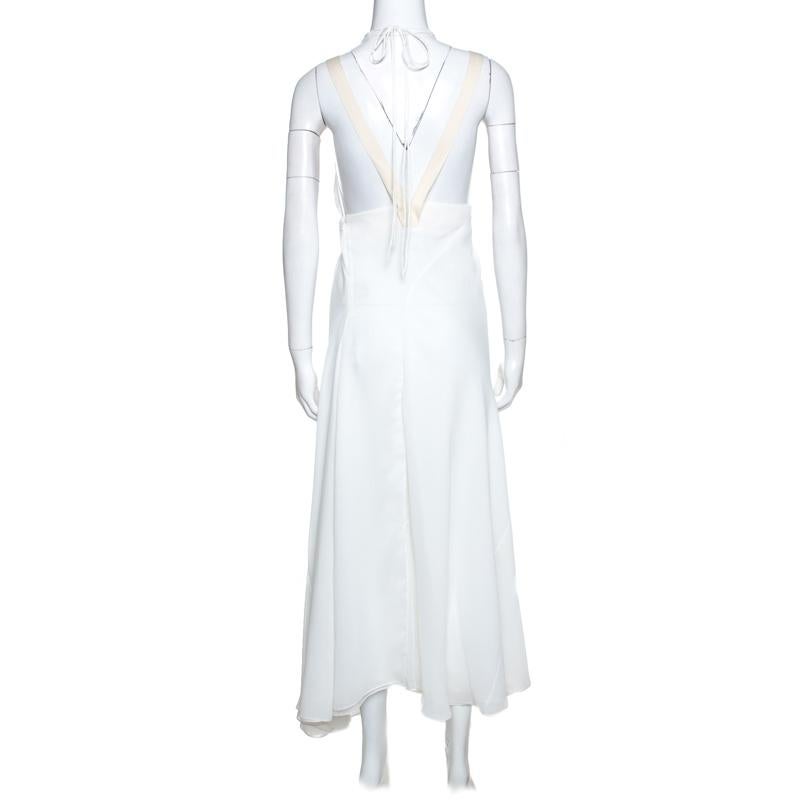 This Chloe dress stands out beautifully. Style this feminine white piece with dainty accessories for a unique and attractive look. Designed to offer a soft feel, the dress features an open back and elegant drapes.

