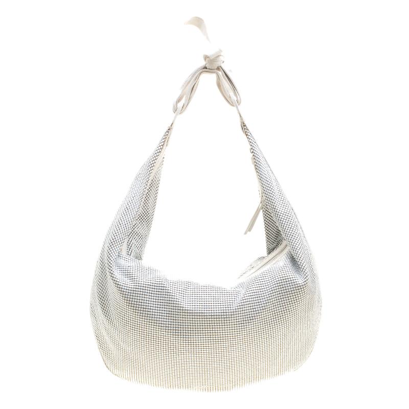 Fancy bags are a wardrobe must-have. Made in Italy, this hobo by Chloe has been crafted very artistically with metal in a mesh style. It also features a well-sized fabric interior and a single handle. This beauty is truly worth the