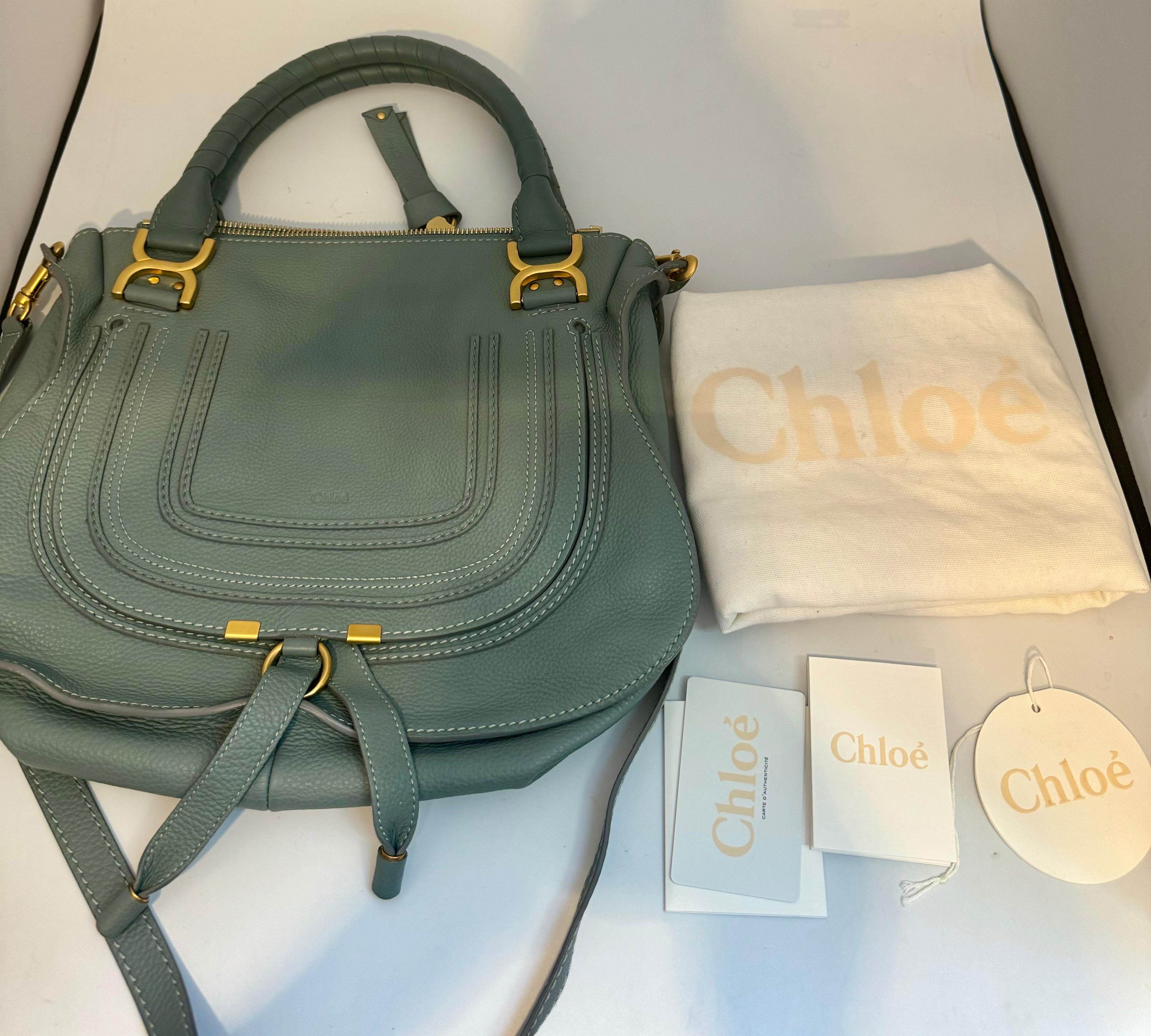 Brand New , Never used , With original Dust bag
Dimensions and specifications
100% Calf Leather
Made in Italy
A more compact version of the iconic Marcie purse, this small double carry bag is crafted from grained calfskin. Clean lines and a