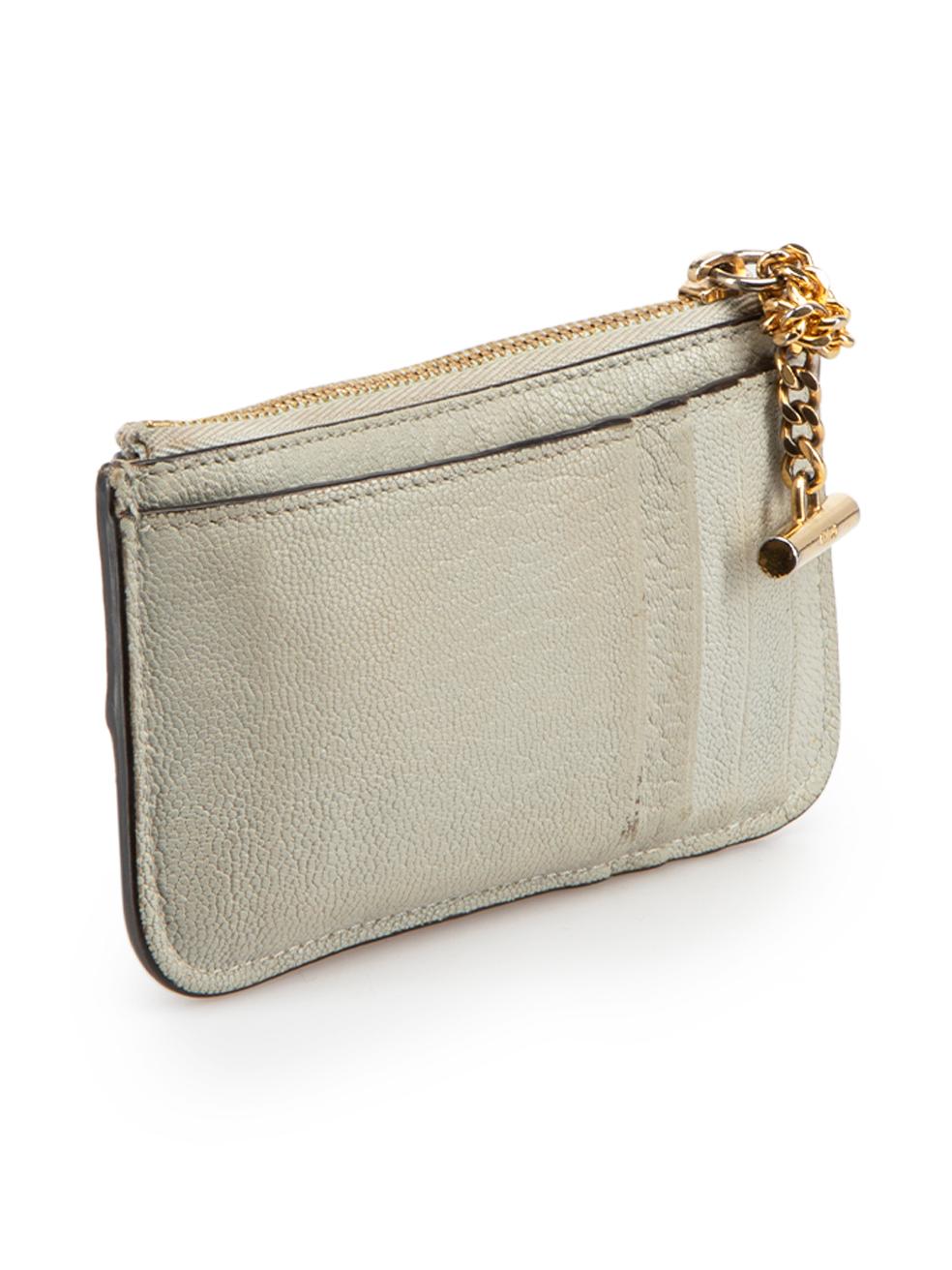 CONDITION is Good. Minor wear to purse is evident. Light wear to the chain hardware with tarnishing on this used Chloé designer resale item.





Details


Grey

Leather

Card holder

Gold tone hardware

1x Main zipped compartment

1x External slip